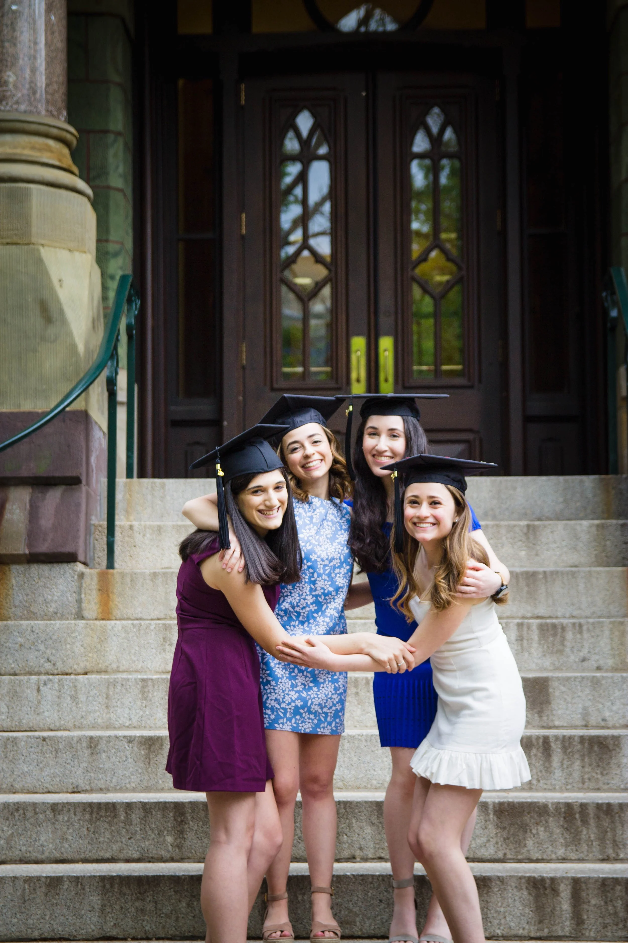 Senior college portrait of a group of female friends wearing graduation caps at the University of Pennsylvania