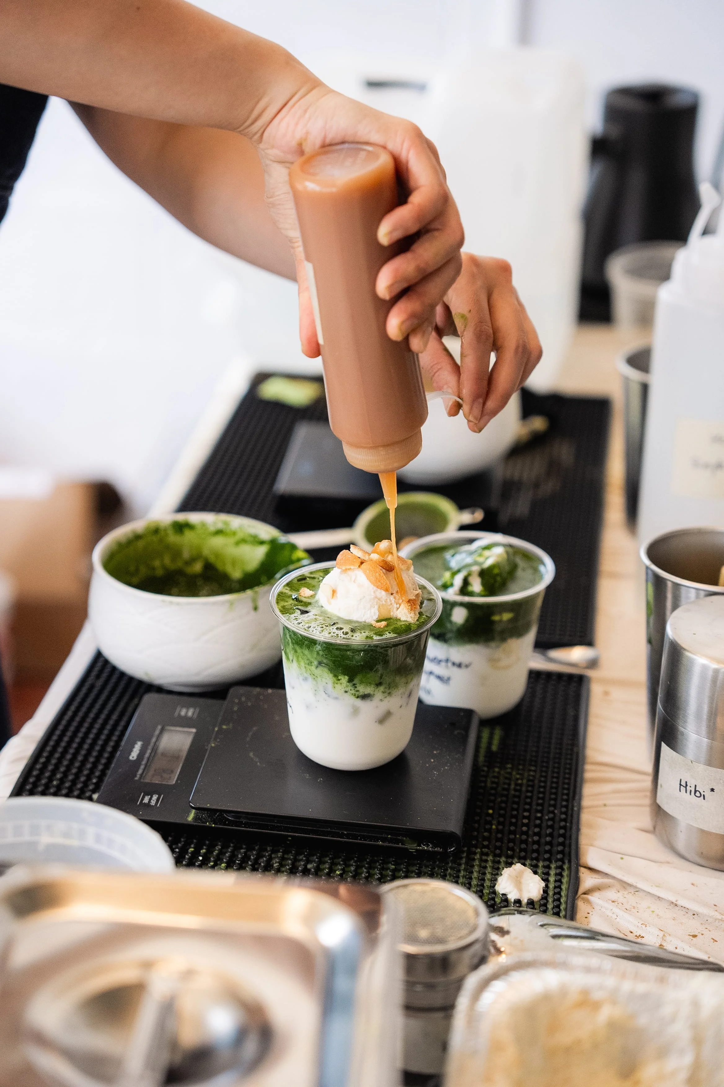 Close up shot of matcha Einspanner preparation during a Tea For Us brand activation pop-up with Kindred Studio in San Francisco