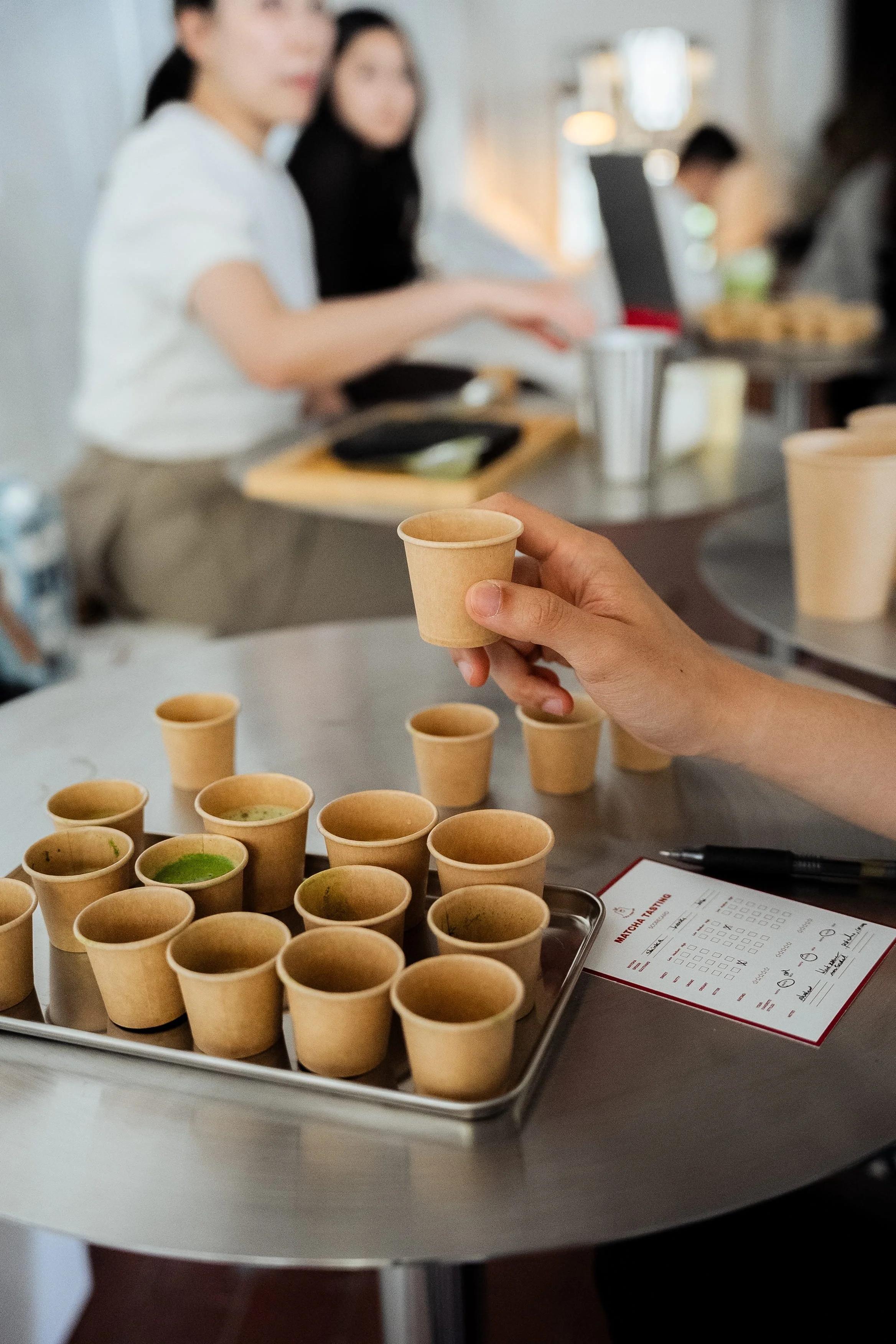 Close up shot of matcha tasting cups during a Tea For Us brand activation pop-up with Kindred Studio in San Francisco