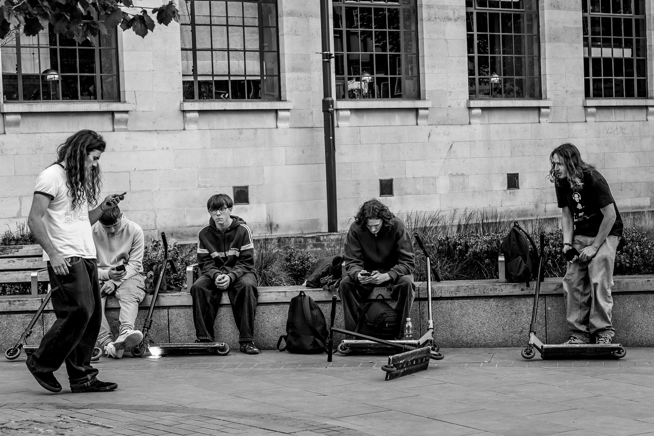 Five skaters four phones.jpg