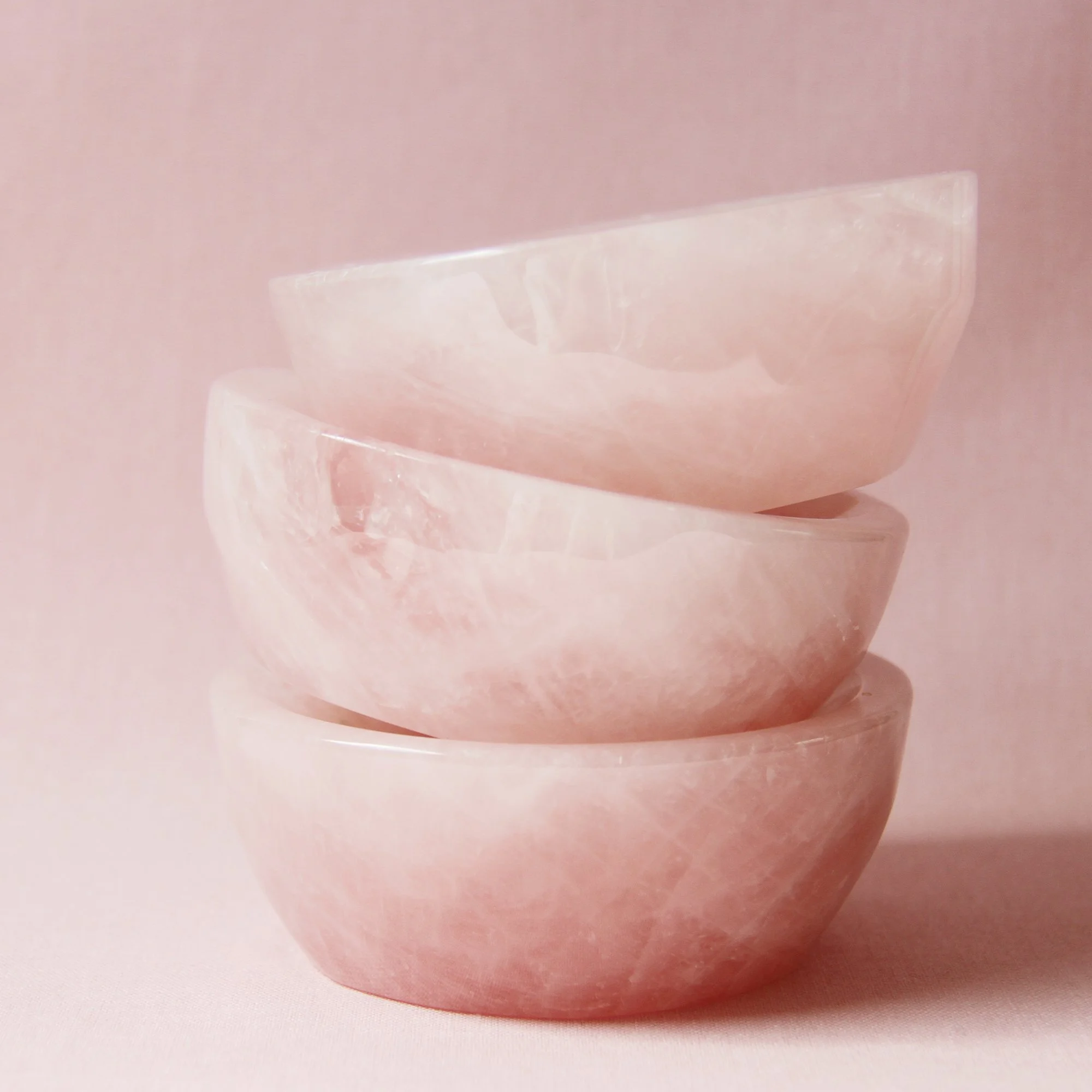 Stack of three rose quartz dishes