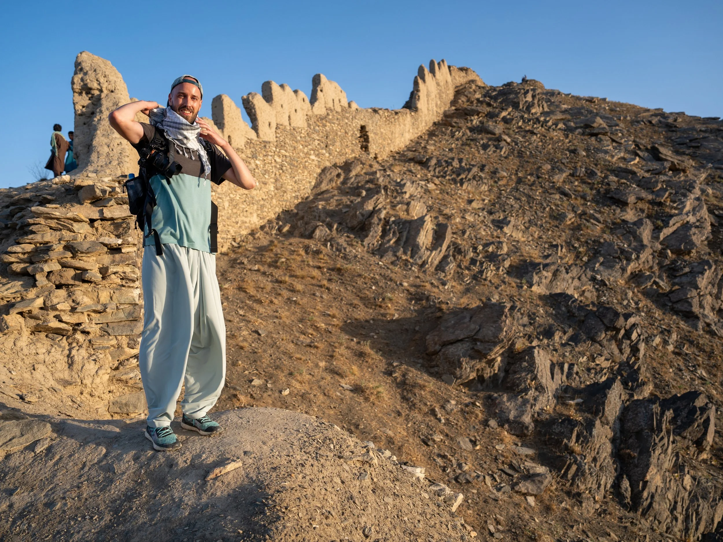 A tourist hikes across the Shir-Darwaza wall walk across the roof of Kabul. 