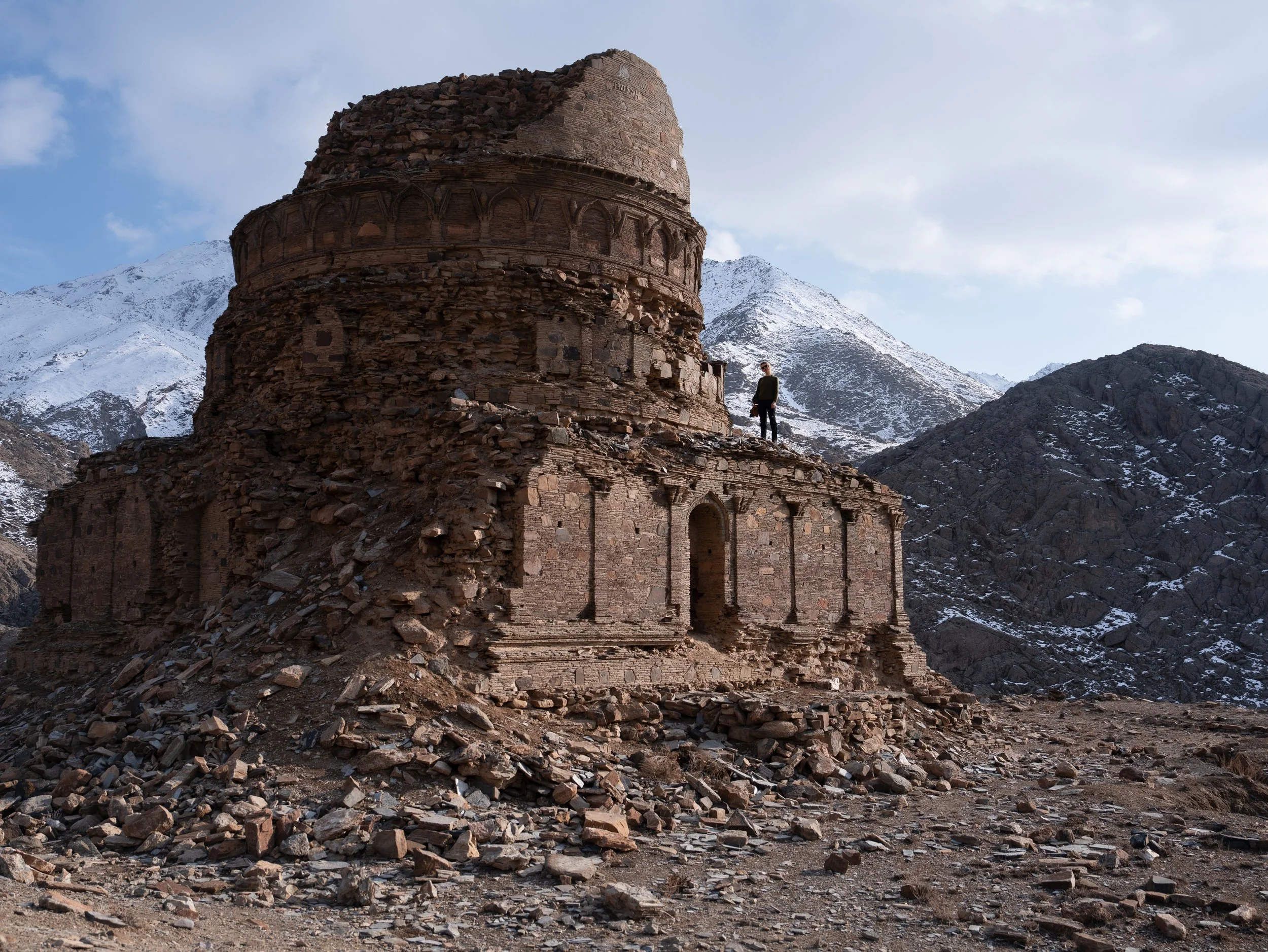 A western female traveller at the buddhist remains of Gul Darra Stupa in Kabul, Afghanistan