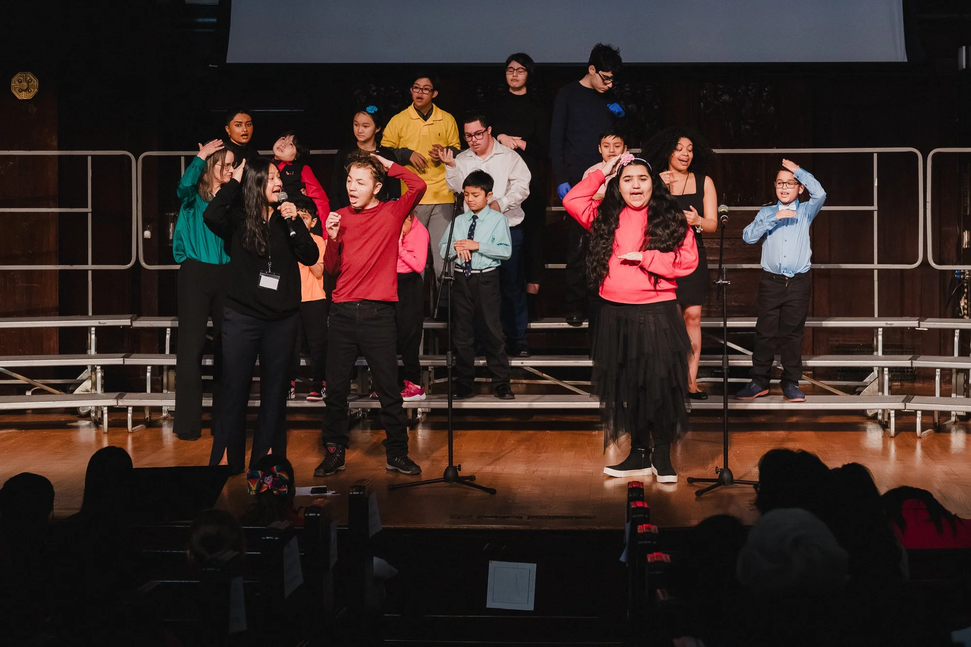 Every Voice Choirs youth performers with choreography and hand gestures during Community Singing at the New York Society for Ethical Culture