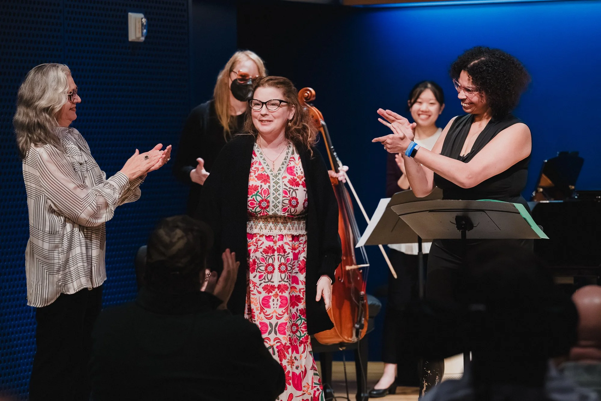 Performers applauding Christine Miserandino, creator of Spoon Theory, during curtain call at the Spoon Theory Song Cycle premiere