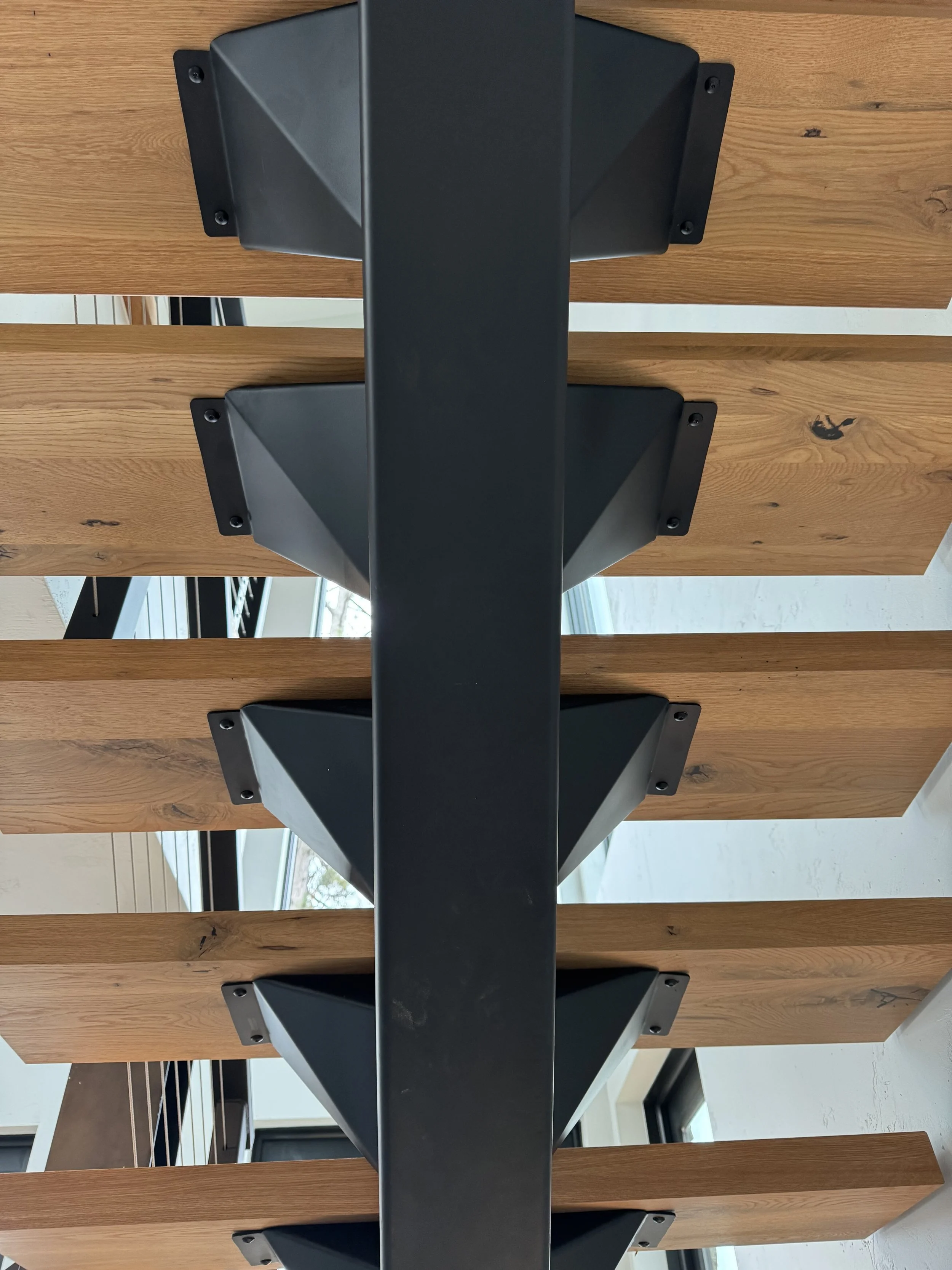 Oak tread staircase with metal rail