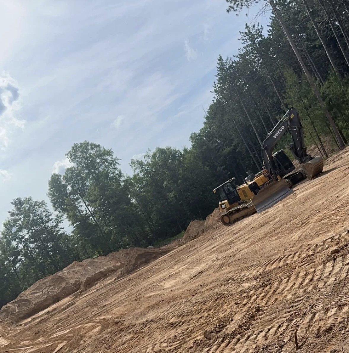 Land clearing with excavator for new construction build