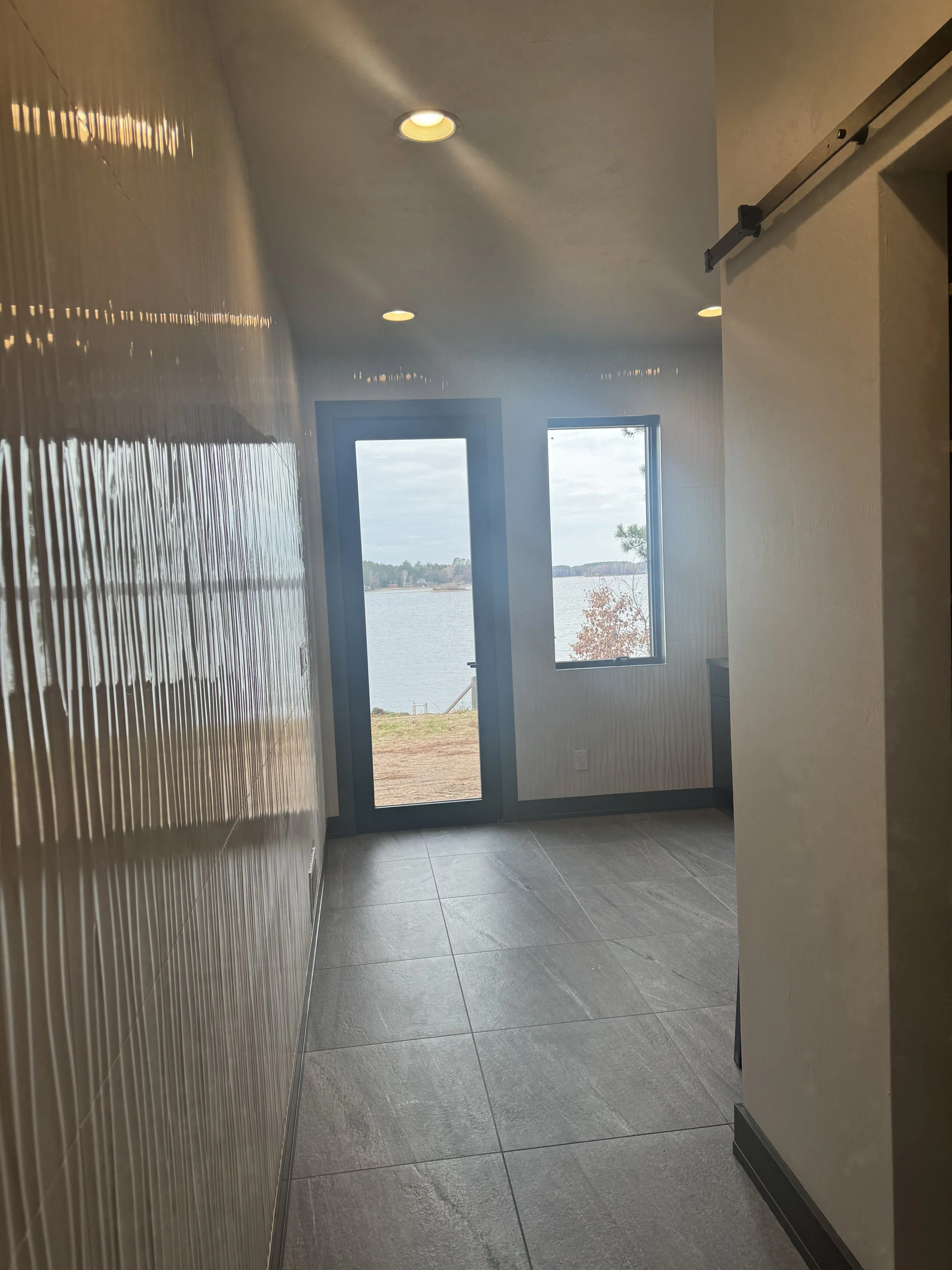 Hallway with tiled wall
