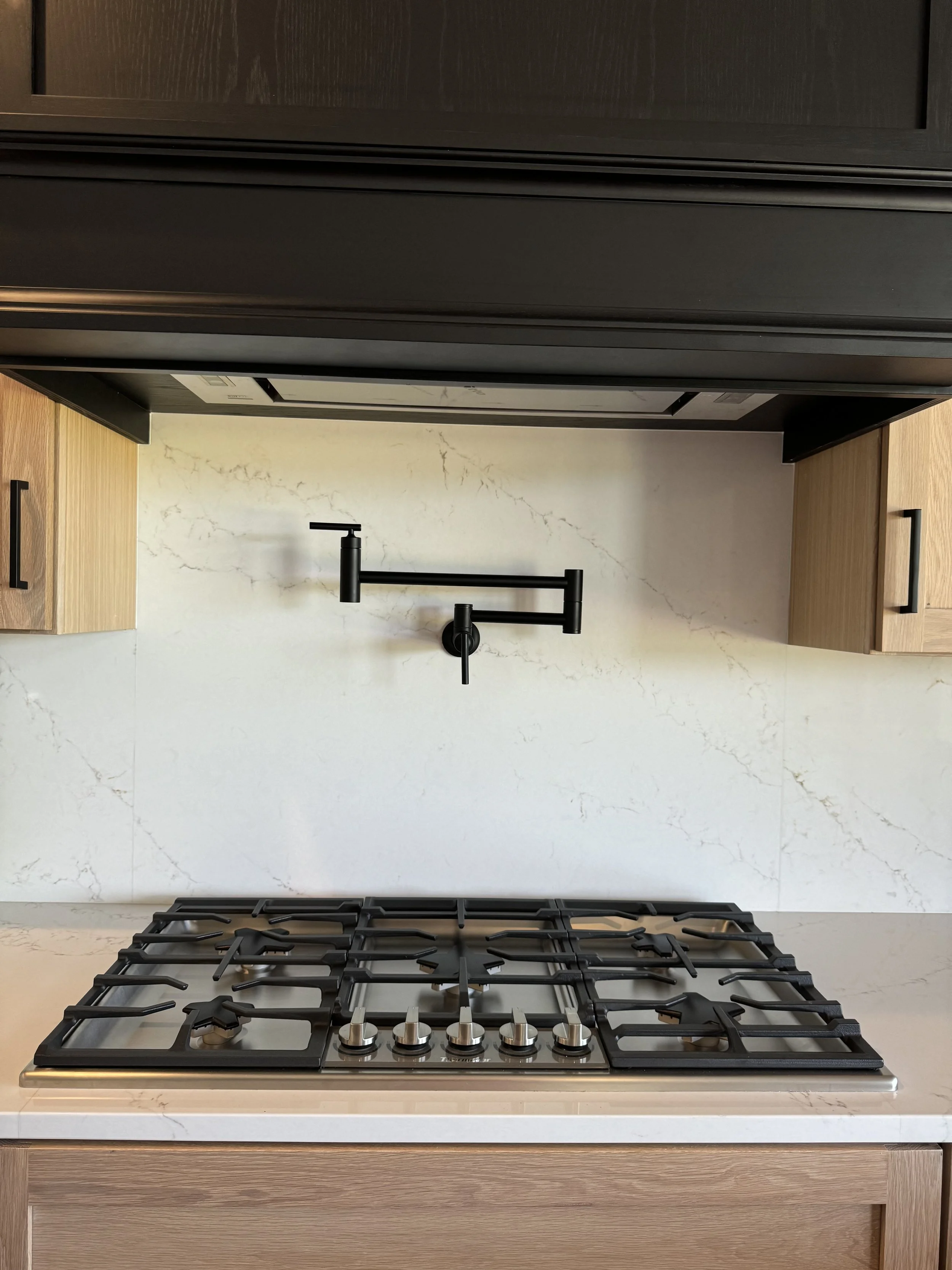 Pot filler over a stove