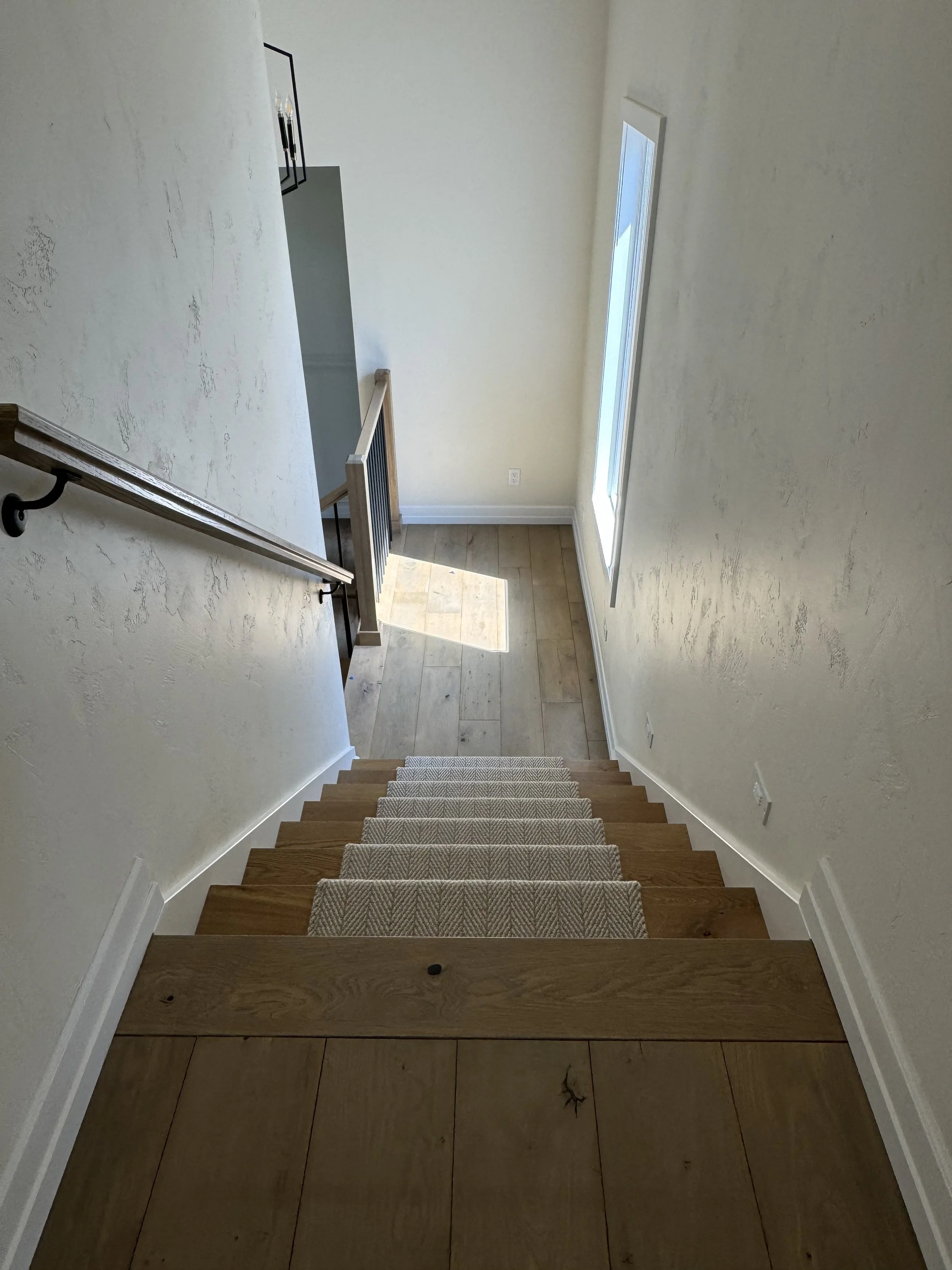 Wooden stairs with runner