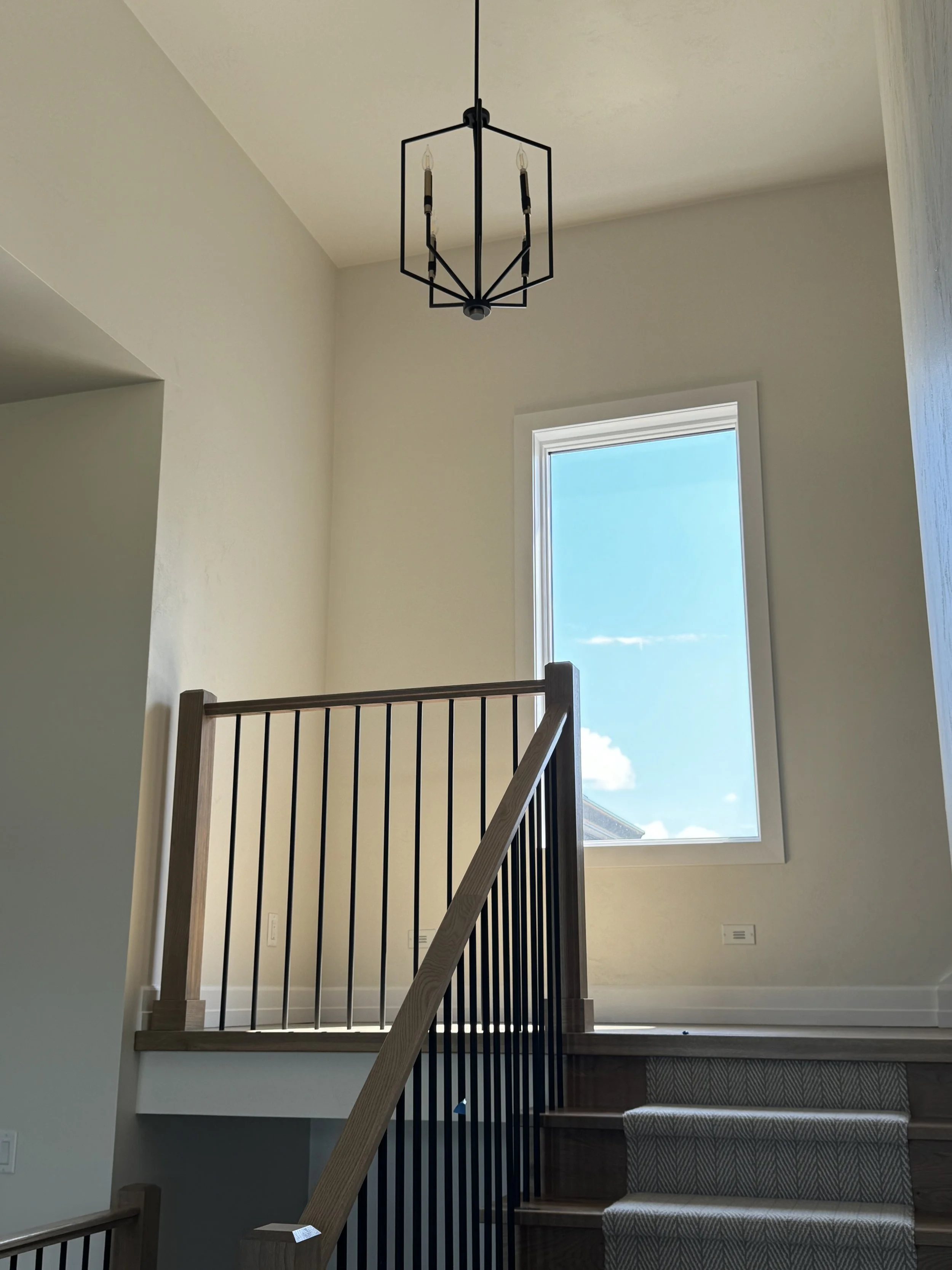 Stairway with modern chandelier
