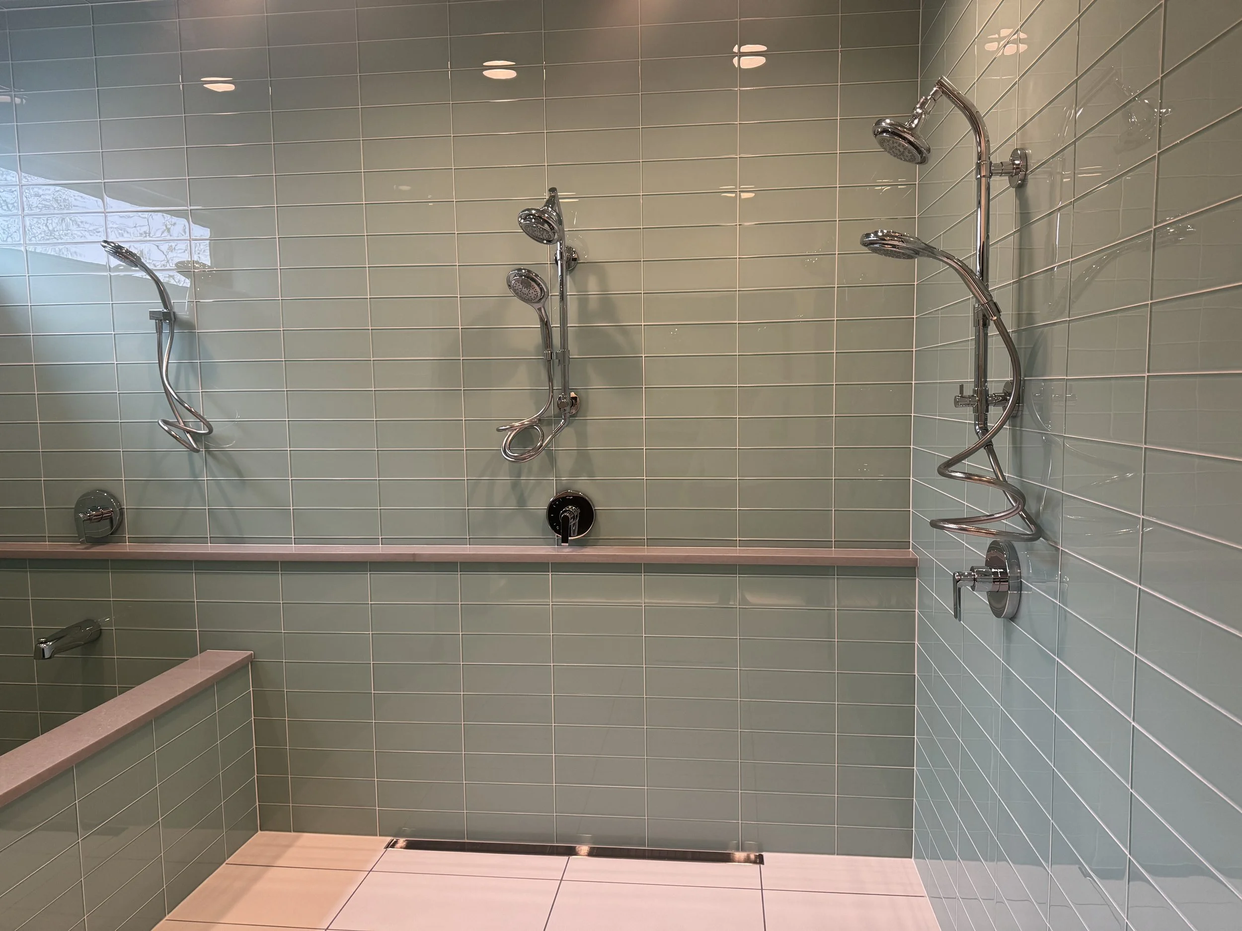 Green glass tile in a built in wetroom