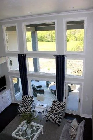 Large windows in living with chairs