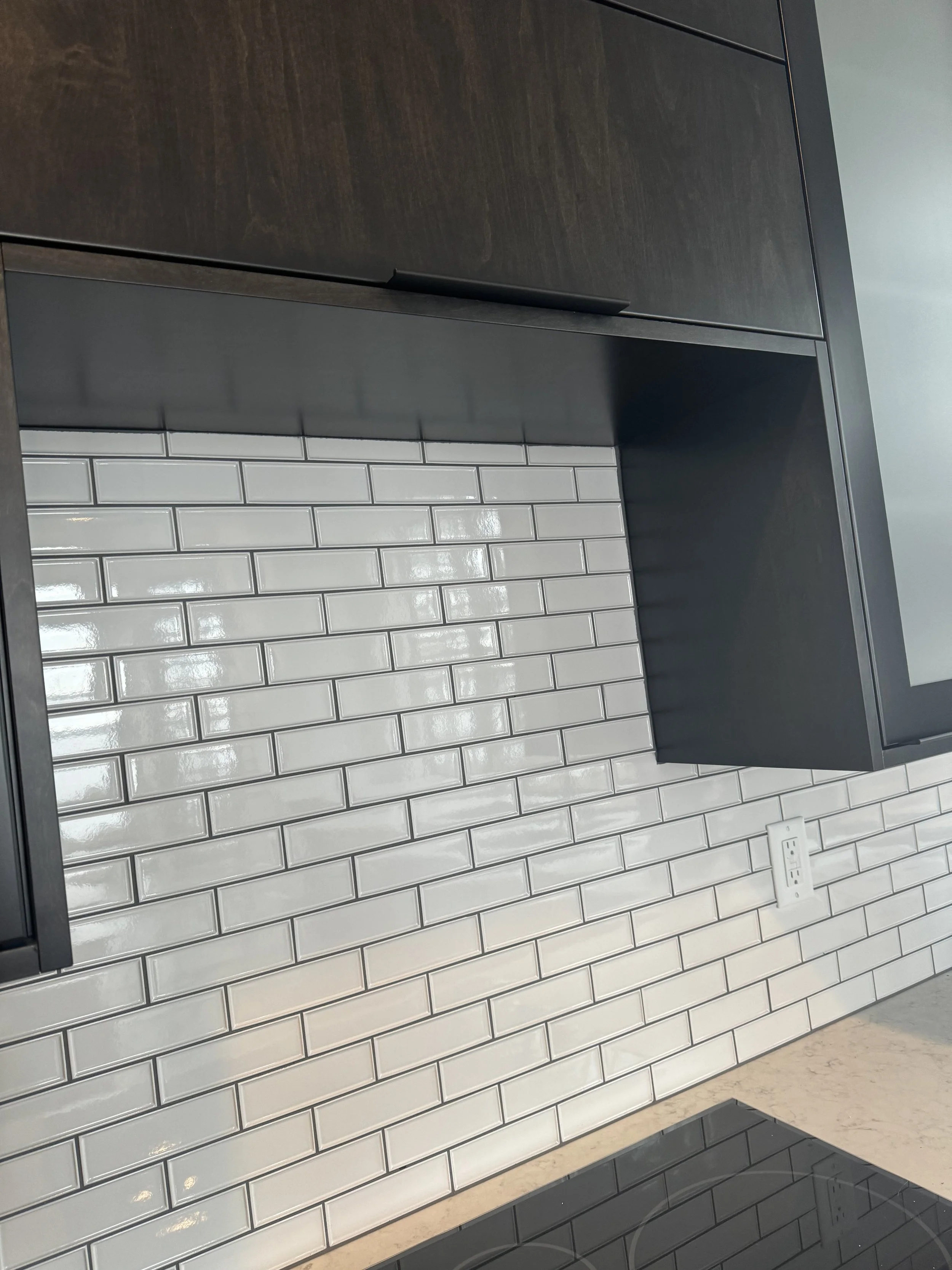 With backsplash with black grout