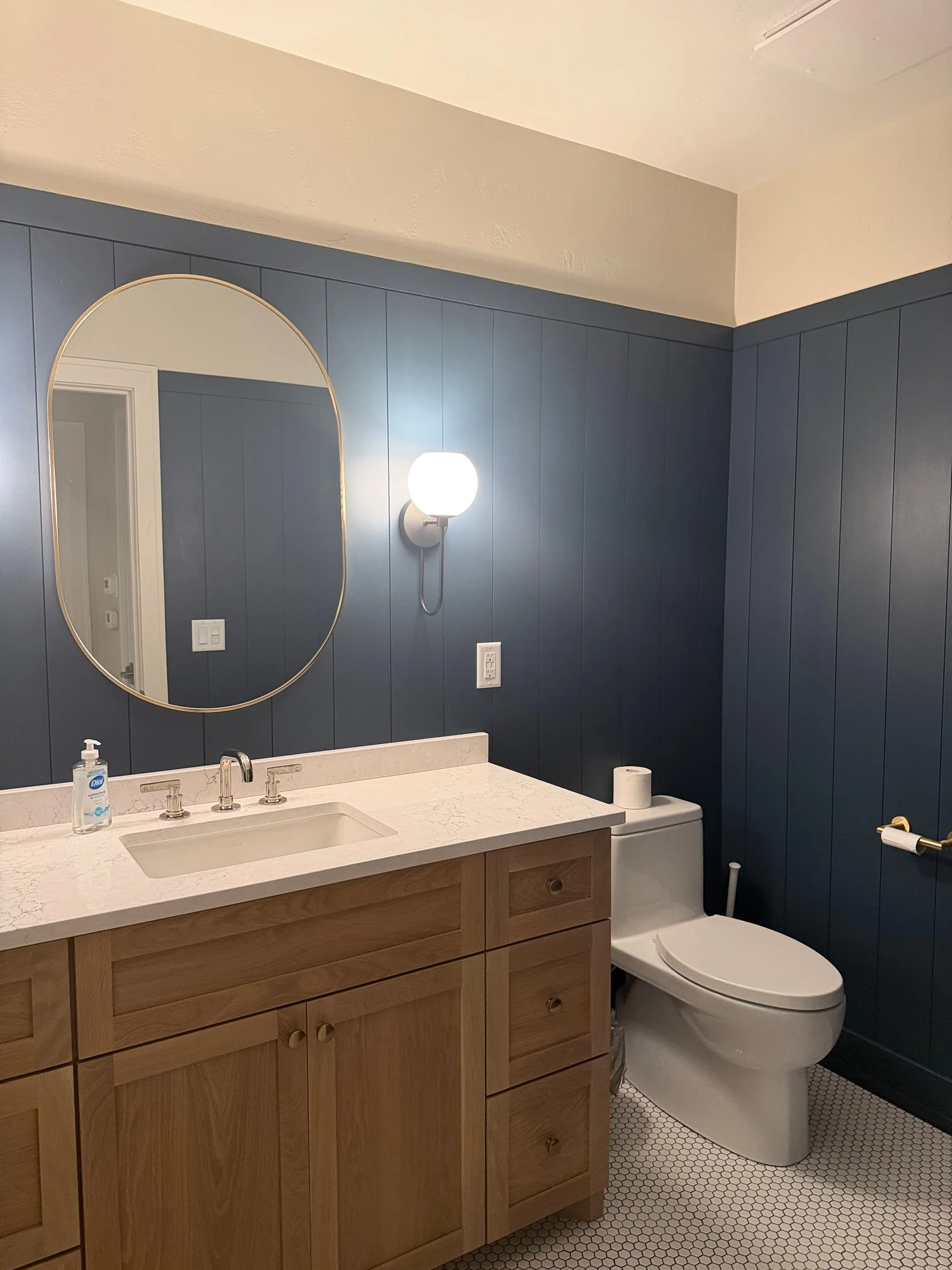 Powder bathroom with navy shiplap walls