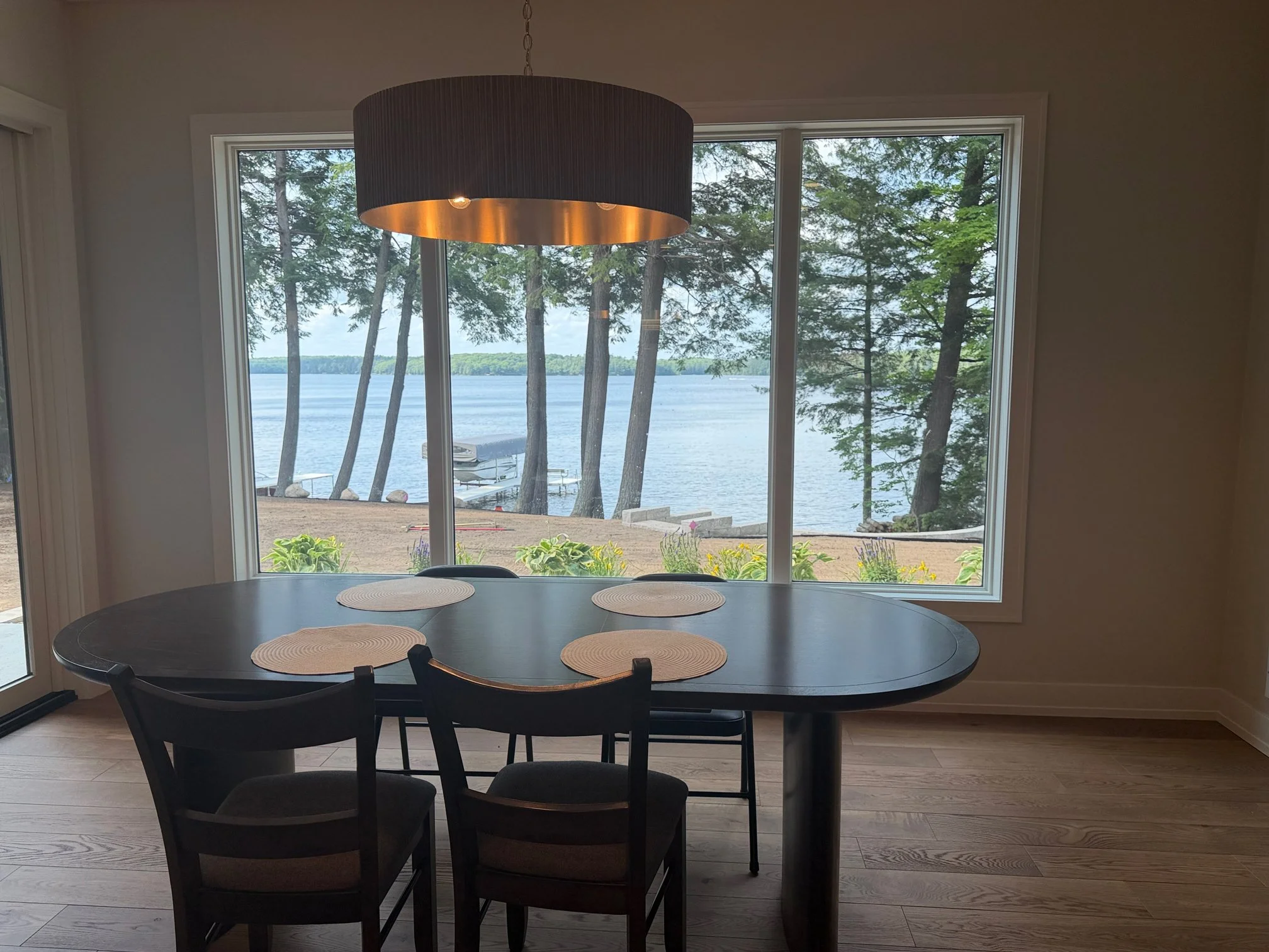 Dining room with lake view and pendant light fixture