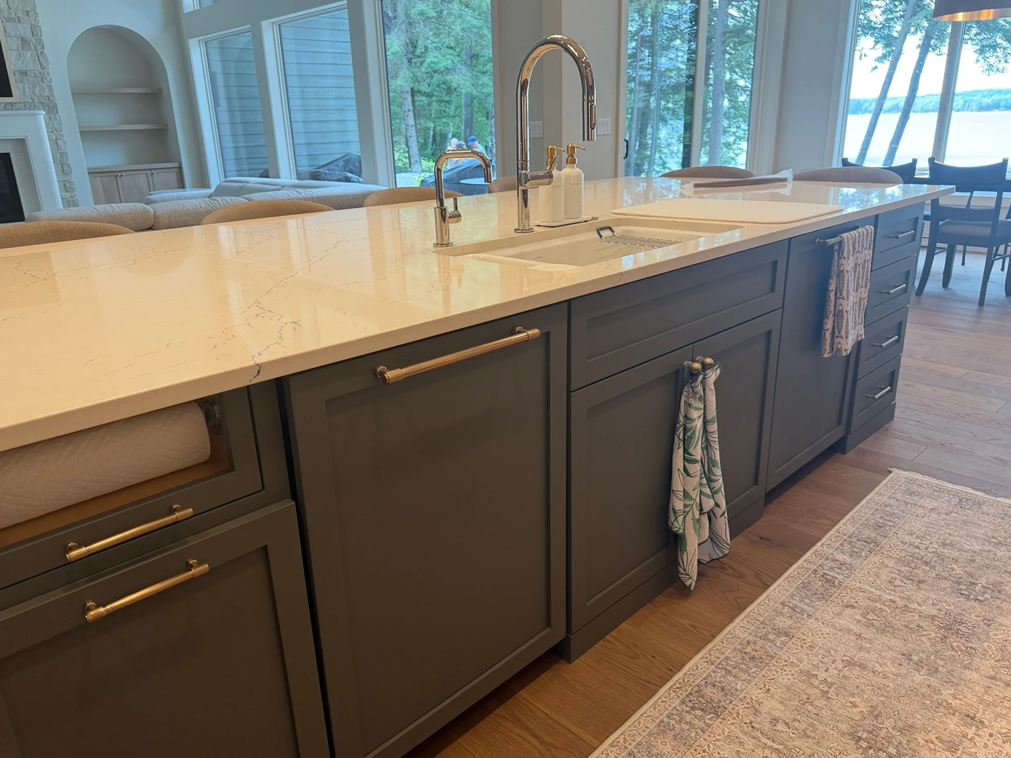 Kitchen island sink with brass fixtures