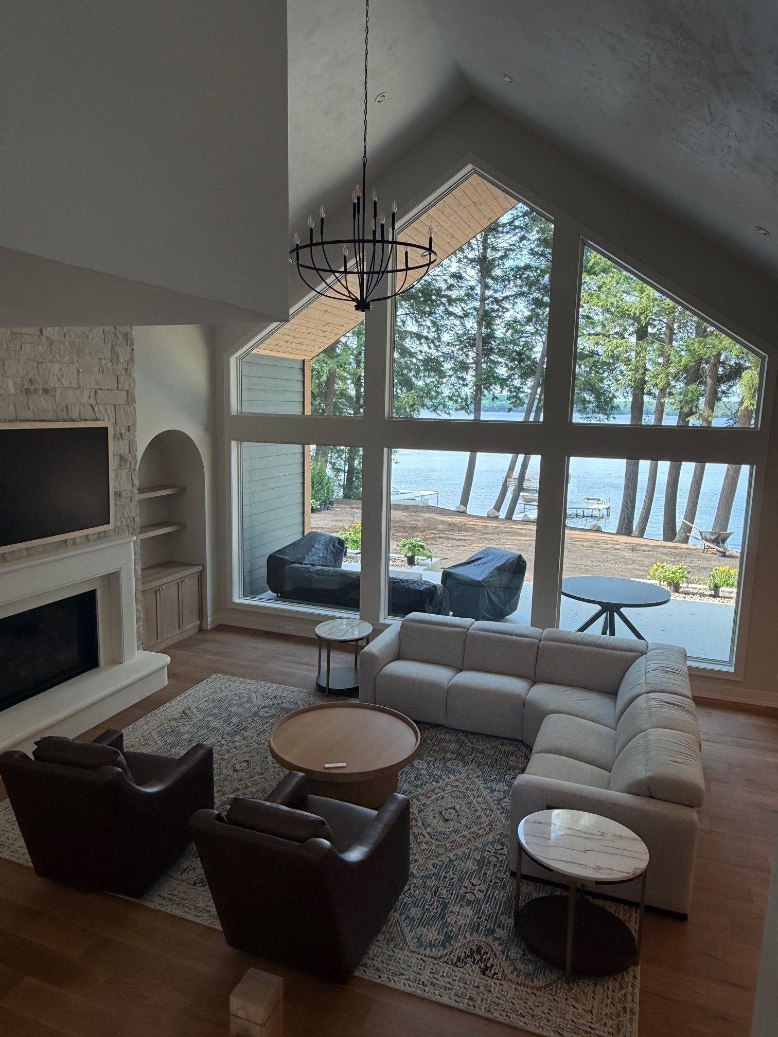 Aerial view of living room fireplace overlooking the lake