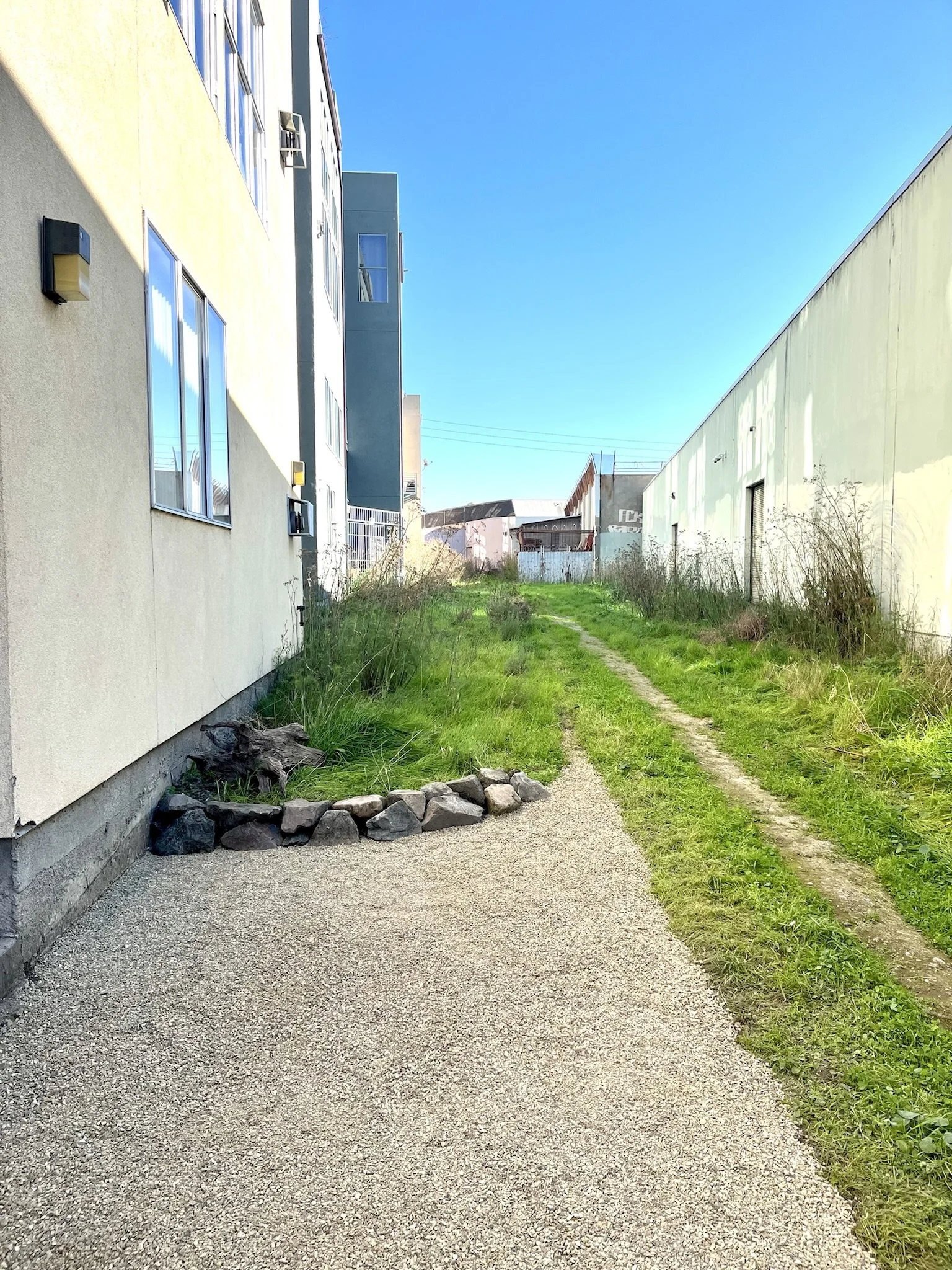 freshly laid gravel and new stonewall in the greenway