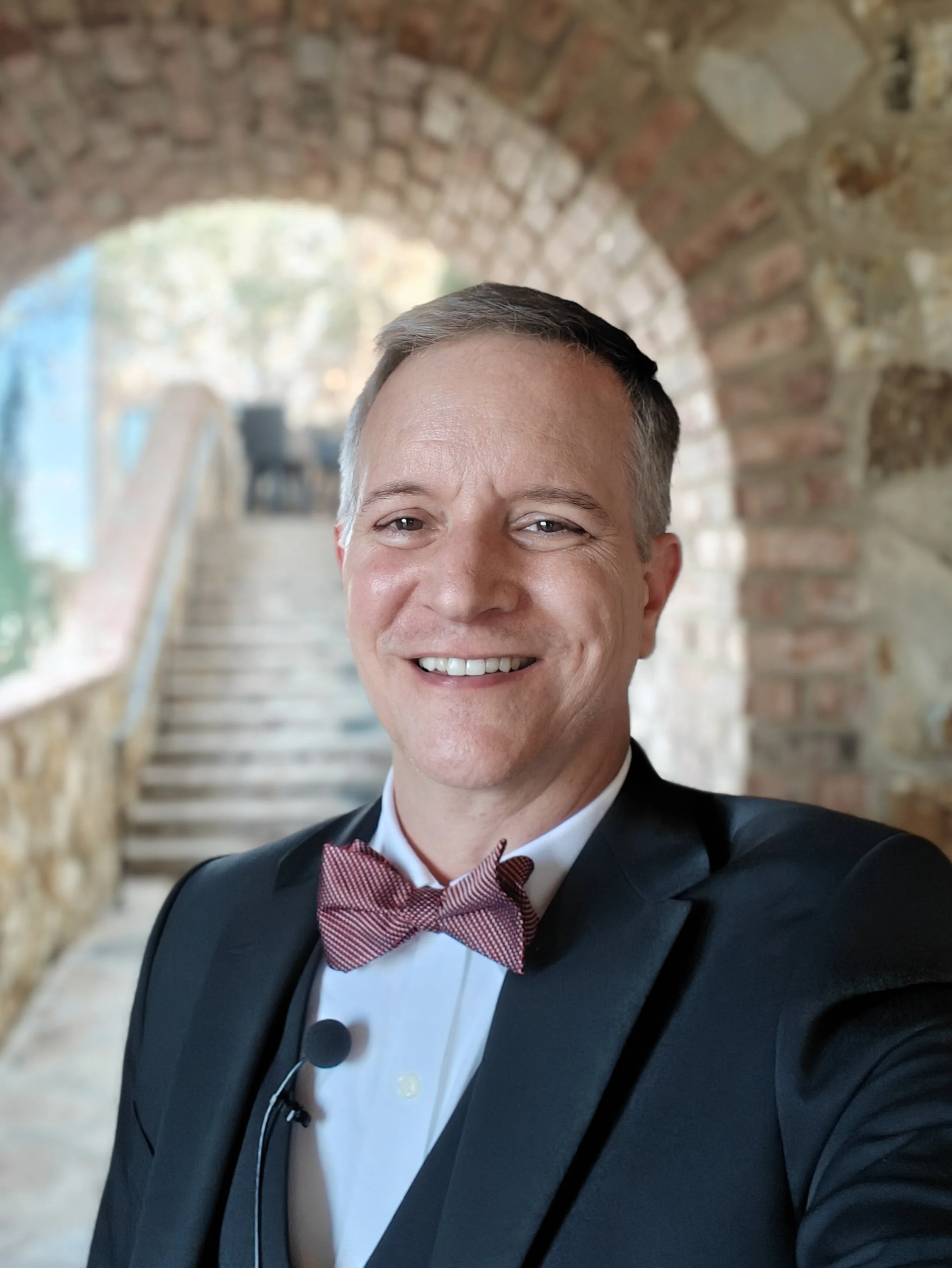 Guy has his microphone ready and is waiting for the ceremony to begin