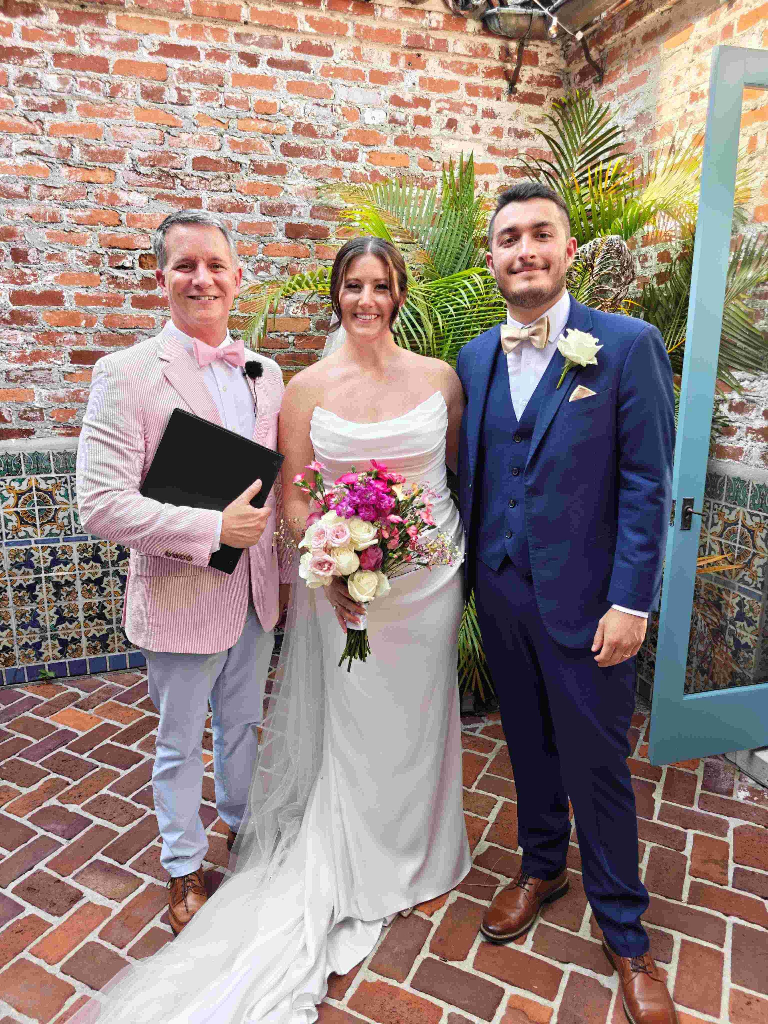Orlando wedding officiant Guy Thee Wed smiles with couple at Casa Feliz in Winter Park