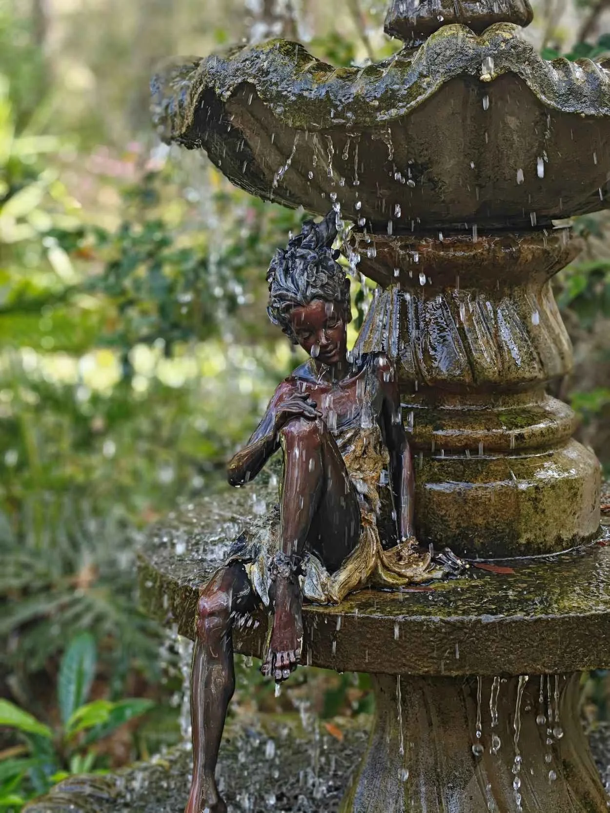 A water nymph is cooling off in a fountain at Harmony Gardens in DeLeon Springs, Florida