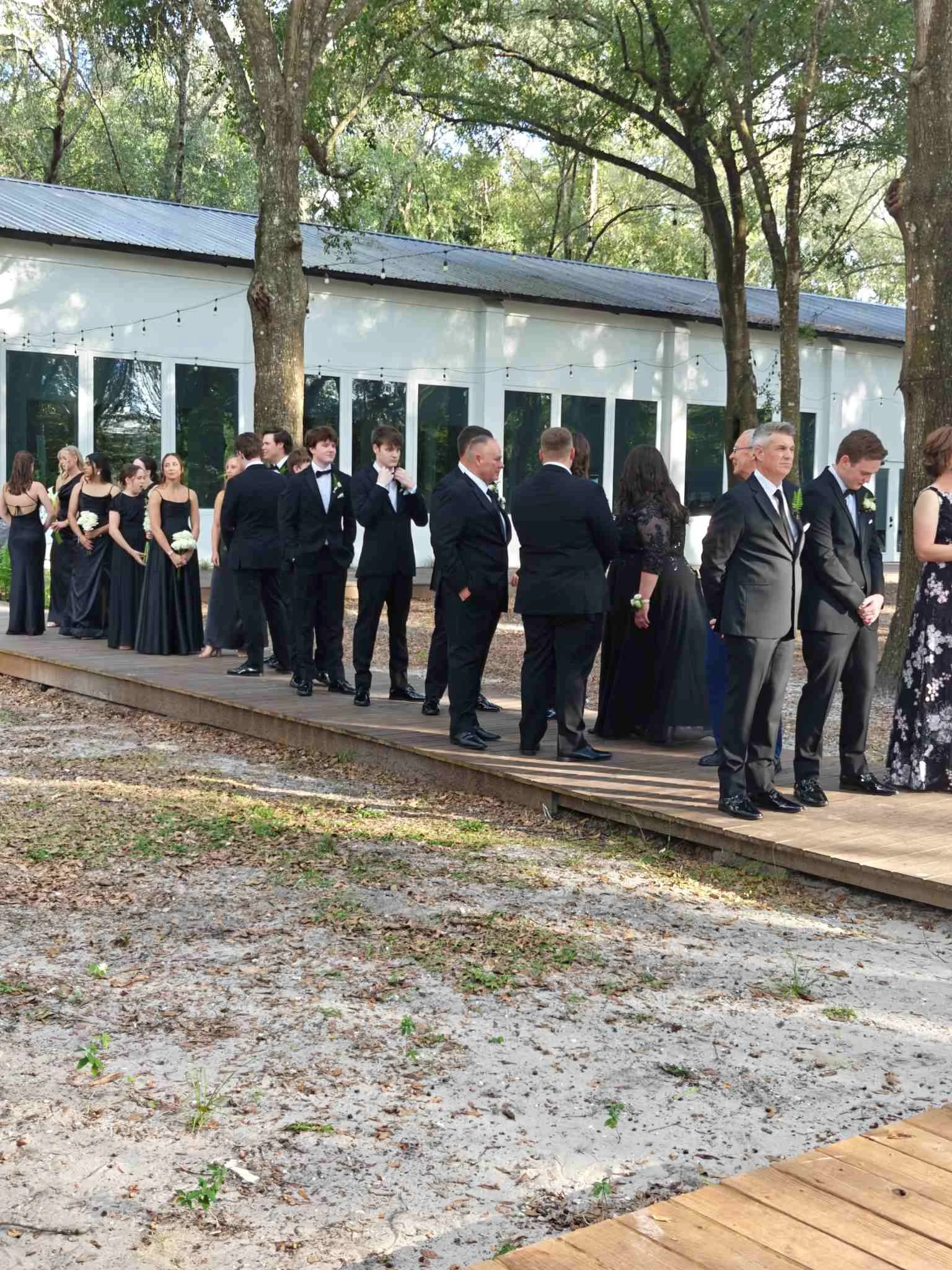 Wedding party at Whitewood Ranch in DeLeon Springs, Florida is waiting to start the processional
