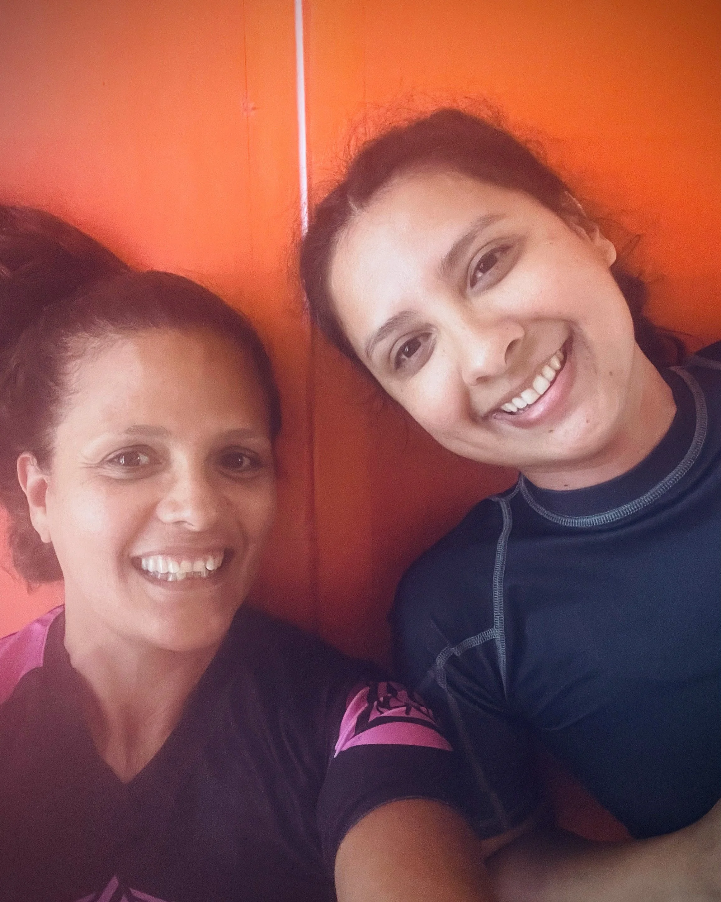Women supporting each other during self-defense training.