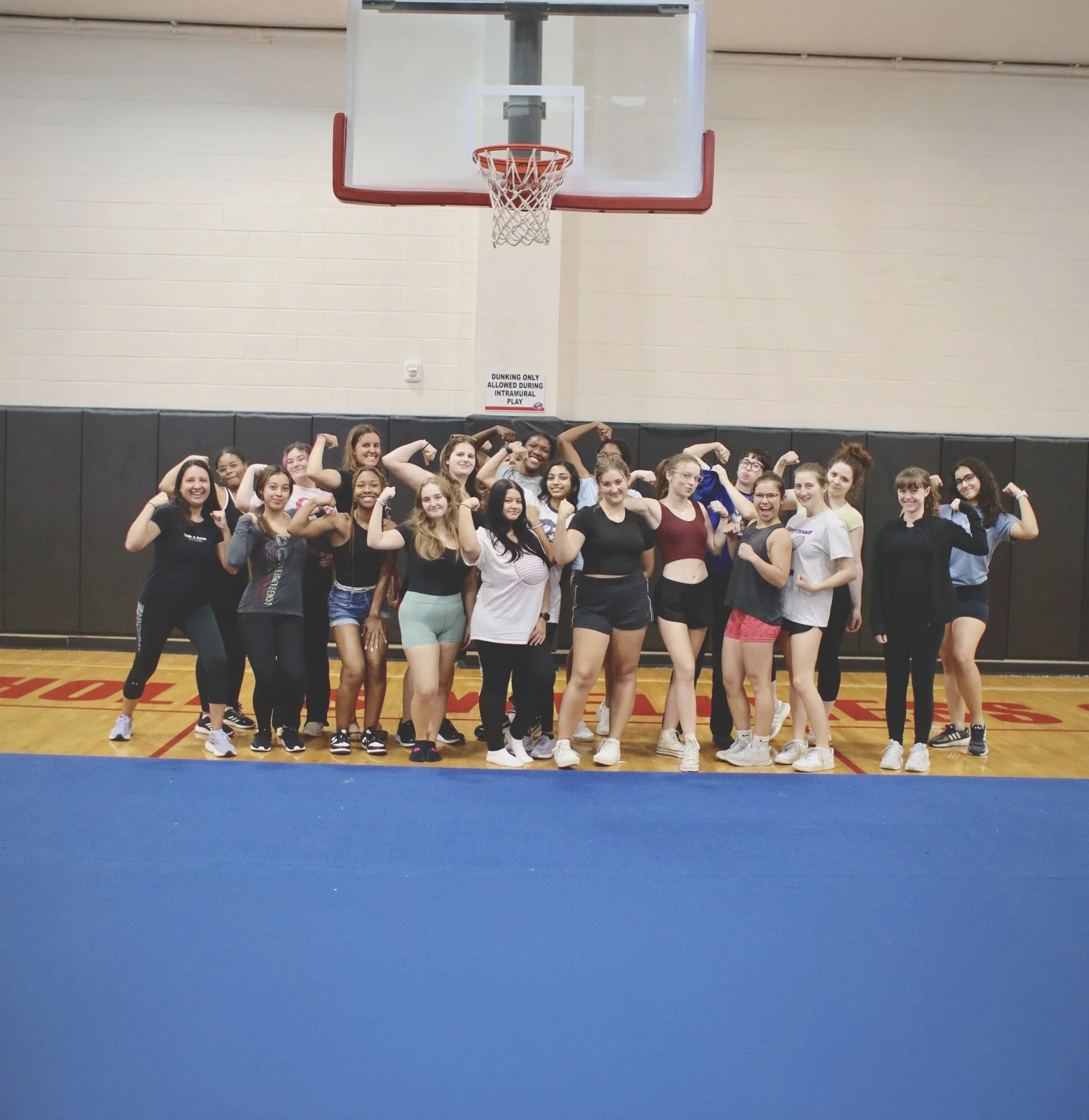 College women participating in self-defense workshop
