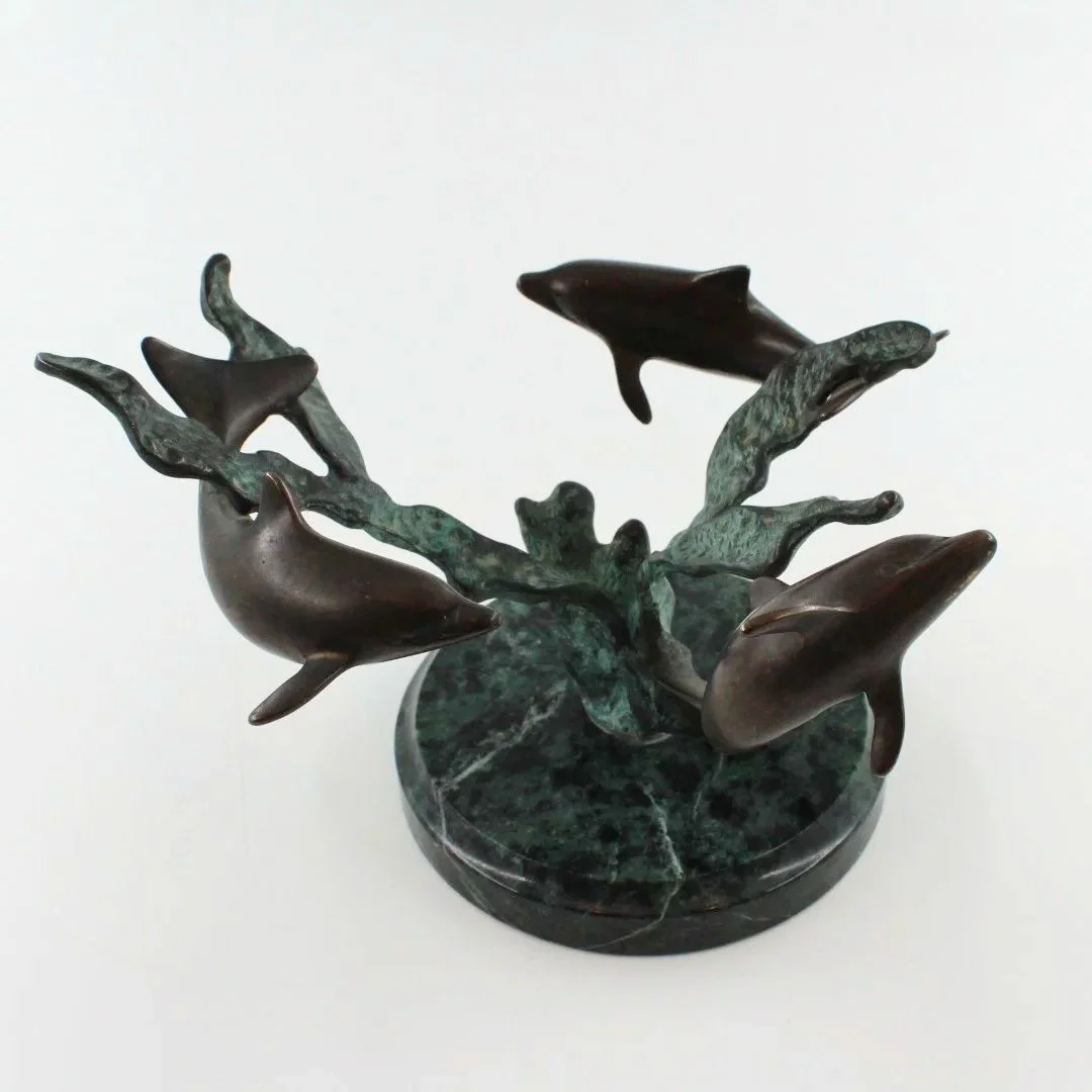 Bronze patinated dolphin sculpture