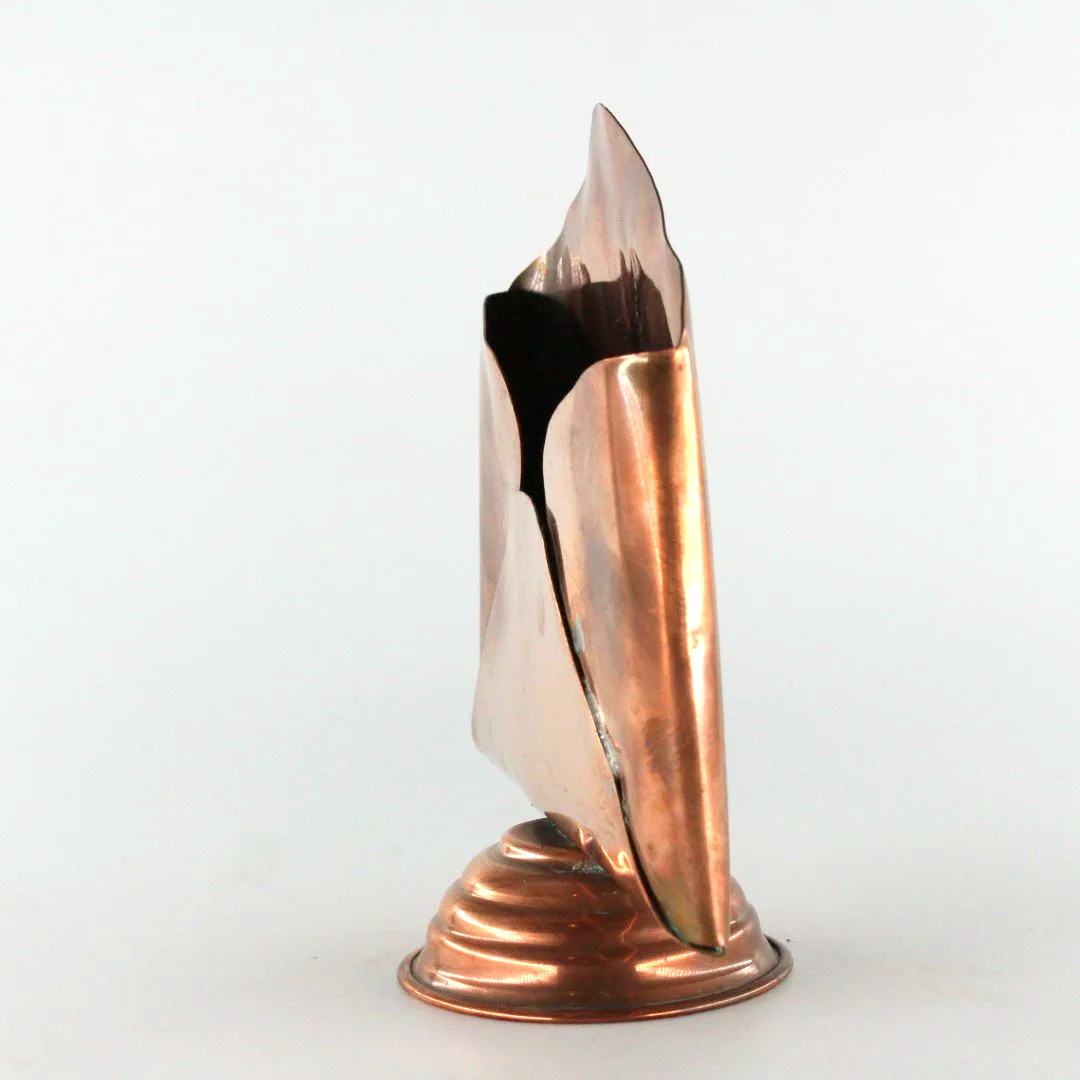 Vintage copper letter rack and mid century modern desk organiser with folded sculptural design and pedestal base against white background.