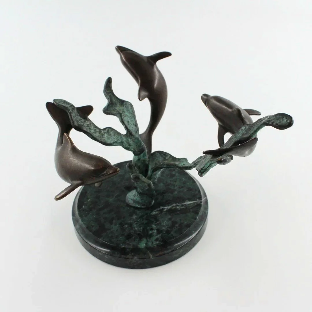 Bronze patinated dolphin sculpture