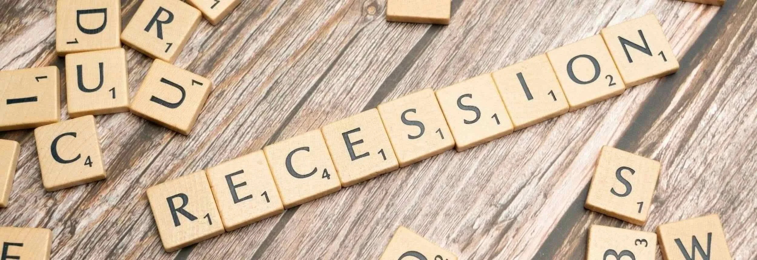 Scrabble tiles spelling out the word, RECESSION.
