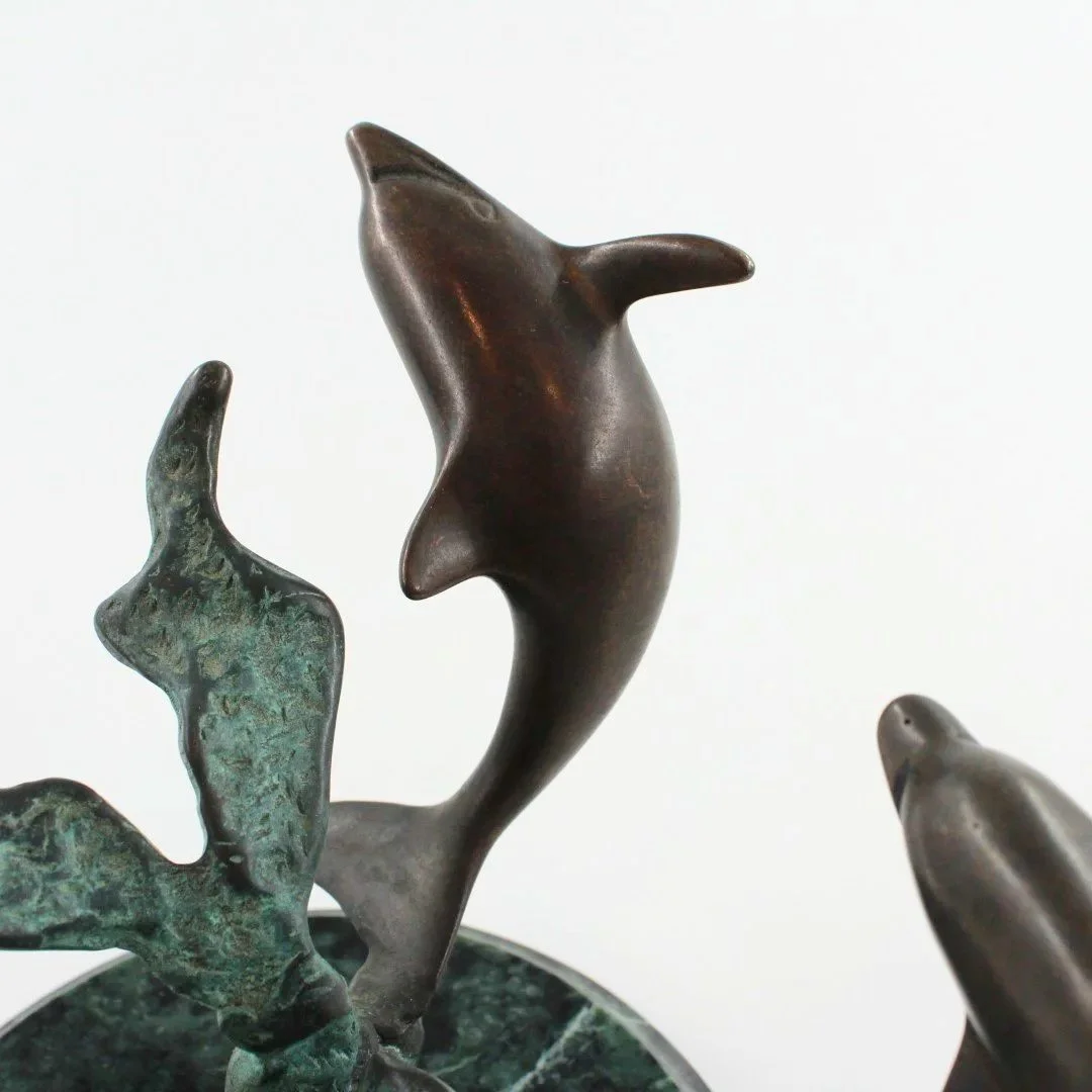 Bronze patinated dolphin sculpture