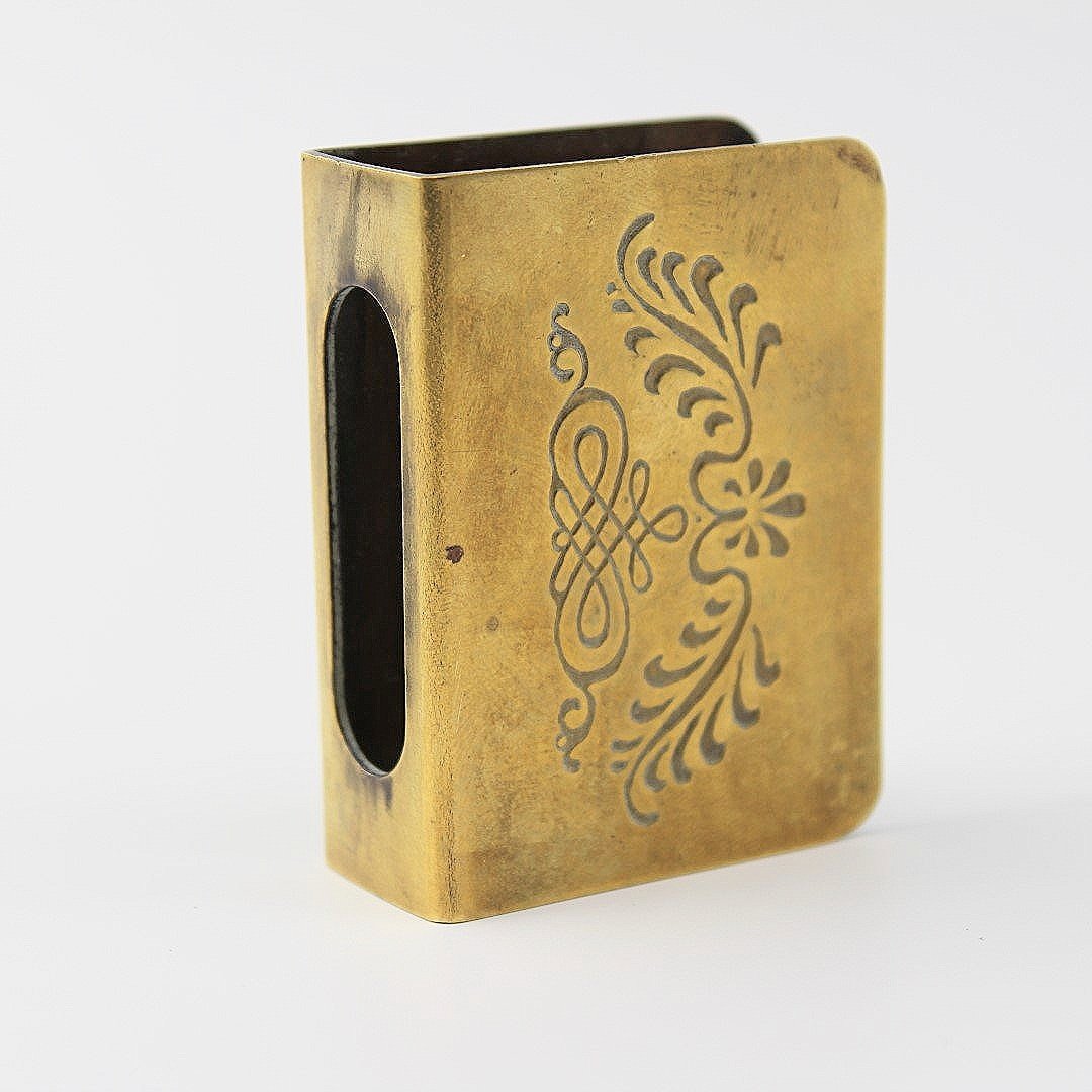 Antique brass matchbox holder decorative faces