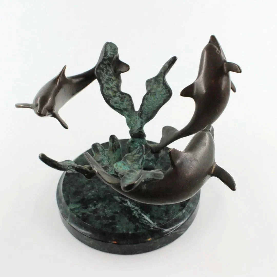 Bronze patinated dolphin sculpture