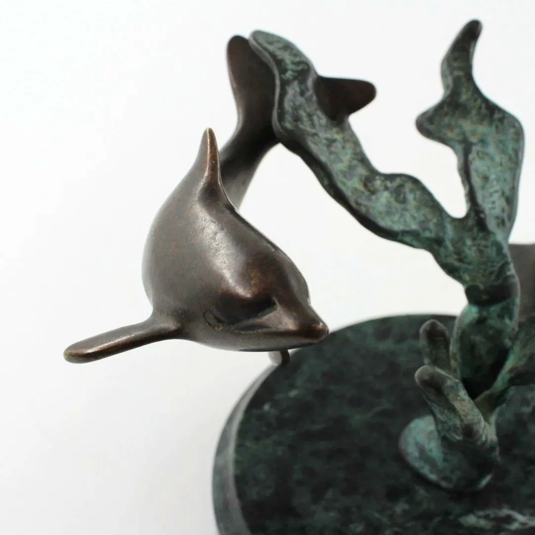 Bronze patinated dolphin sculpture