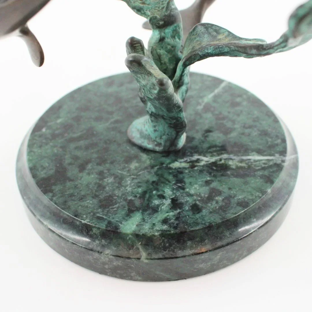 Bronze patinated dolphin sculpture