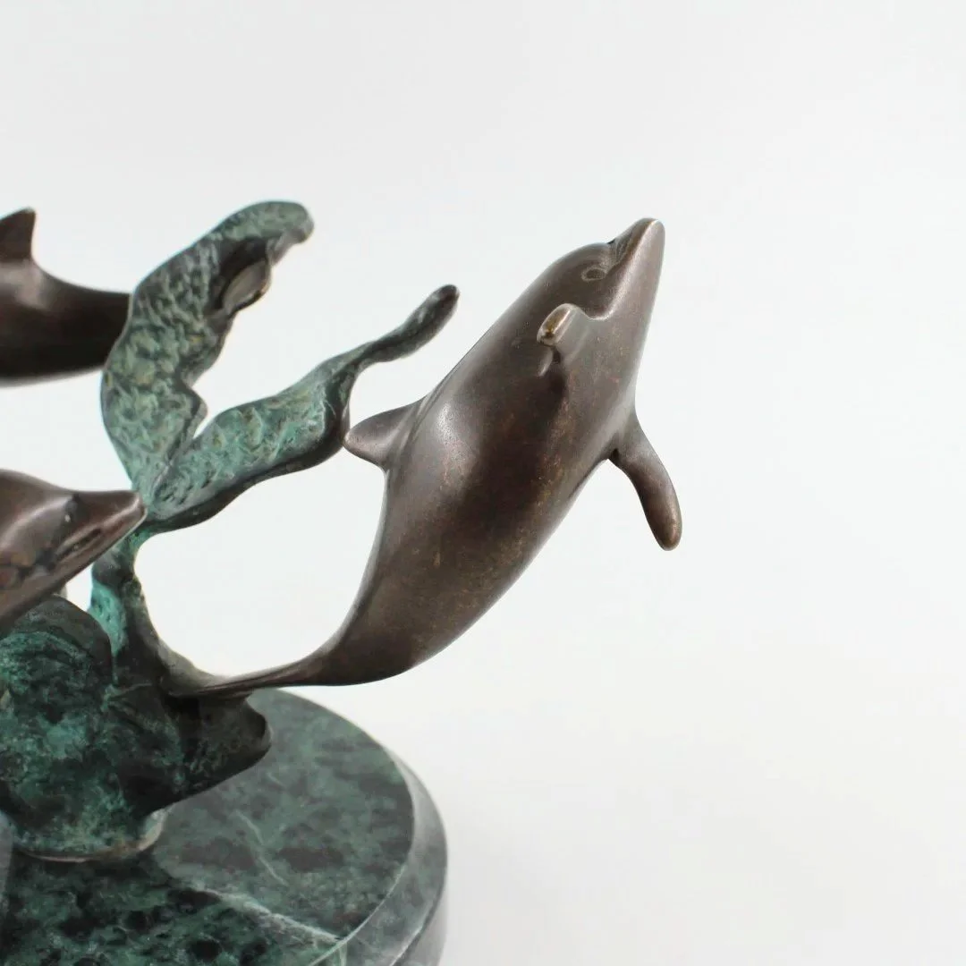 Bronze patinated dolphin sculpture