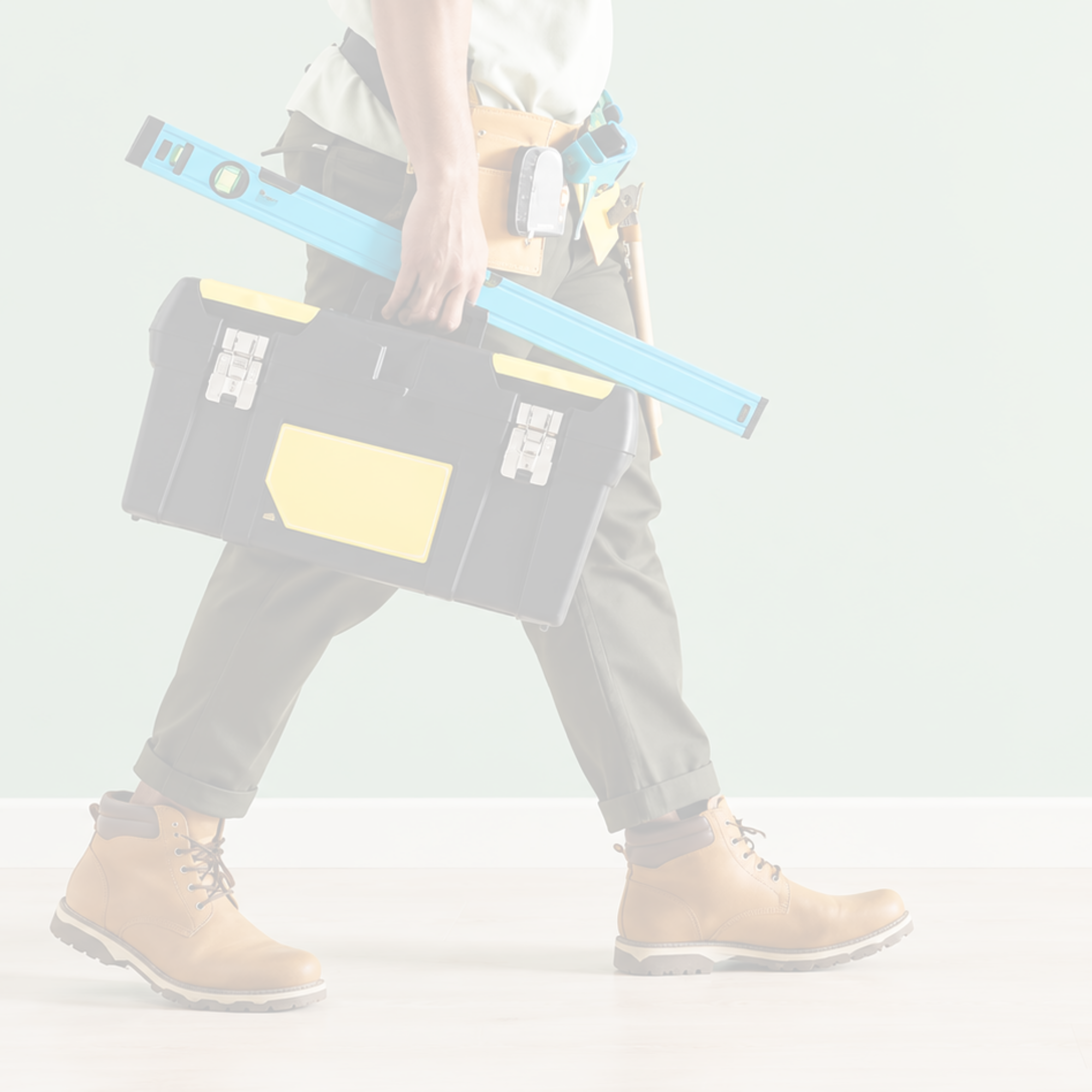 Home maintenance professional carrying tools and a toolbox