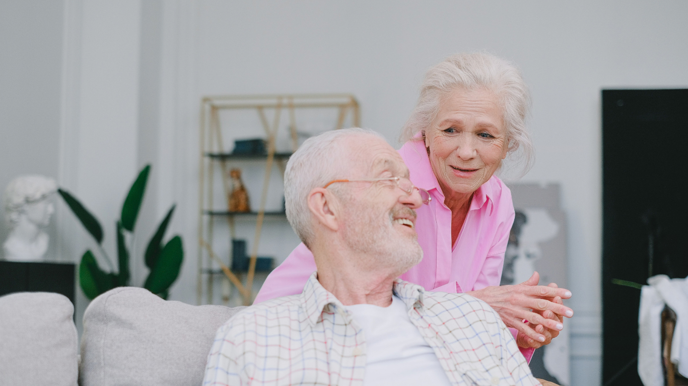 Older couple talking together at home