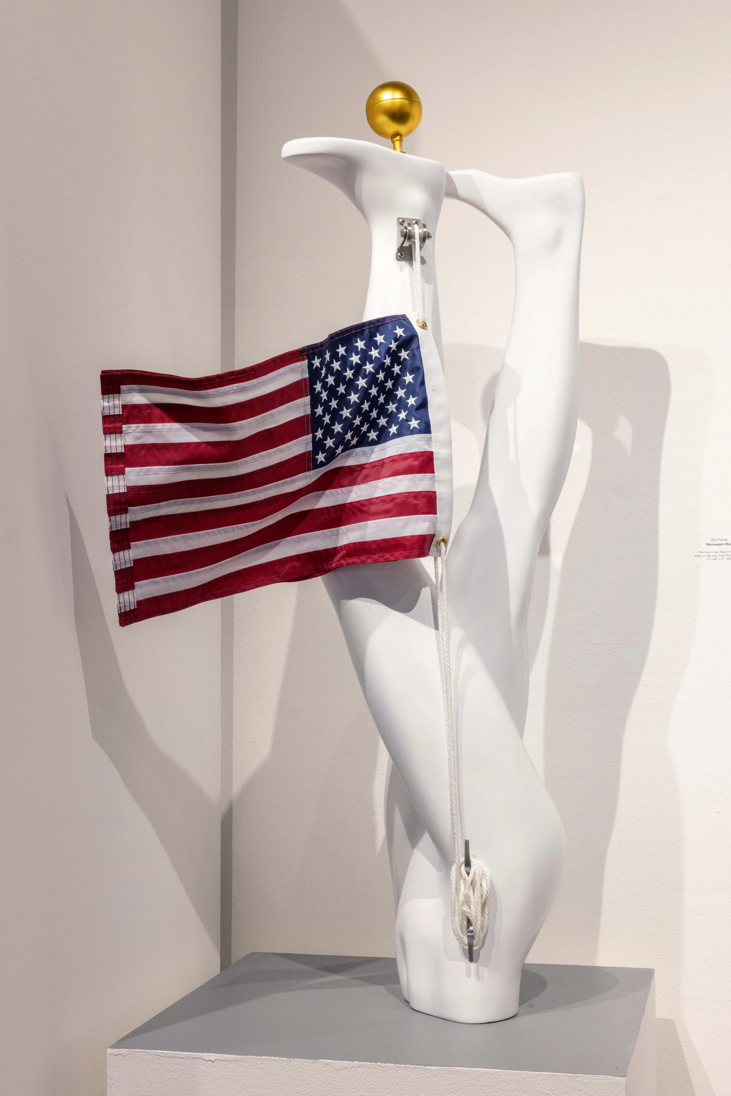 "Mannequin Mast," mannequin legs, flagpole kit, American flag, autobody filler, spray paint. 