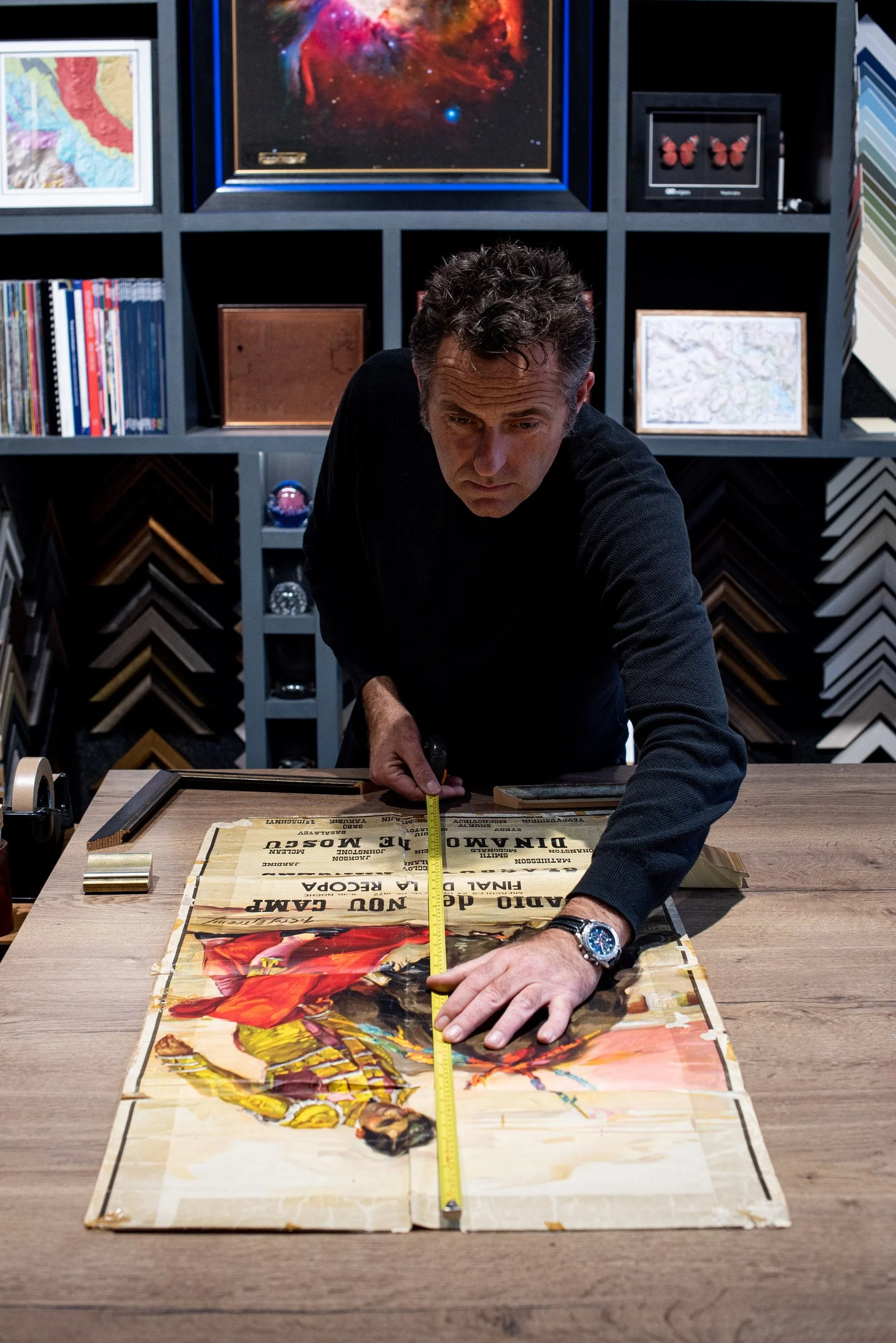 Ed measuring artwork to be framed