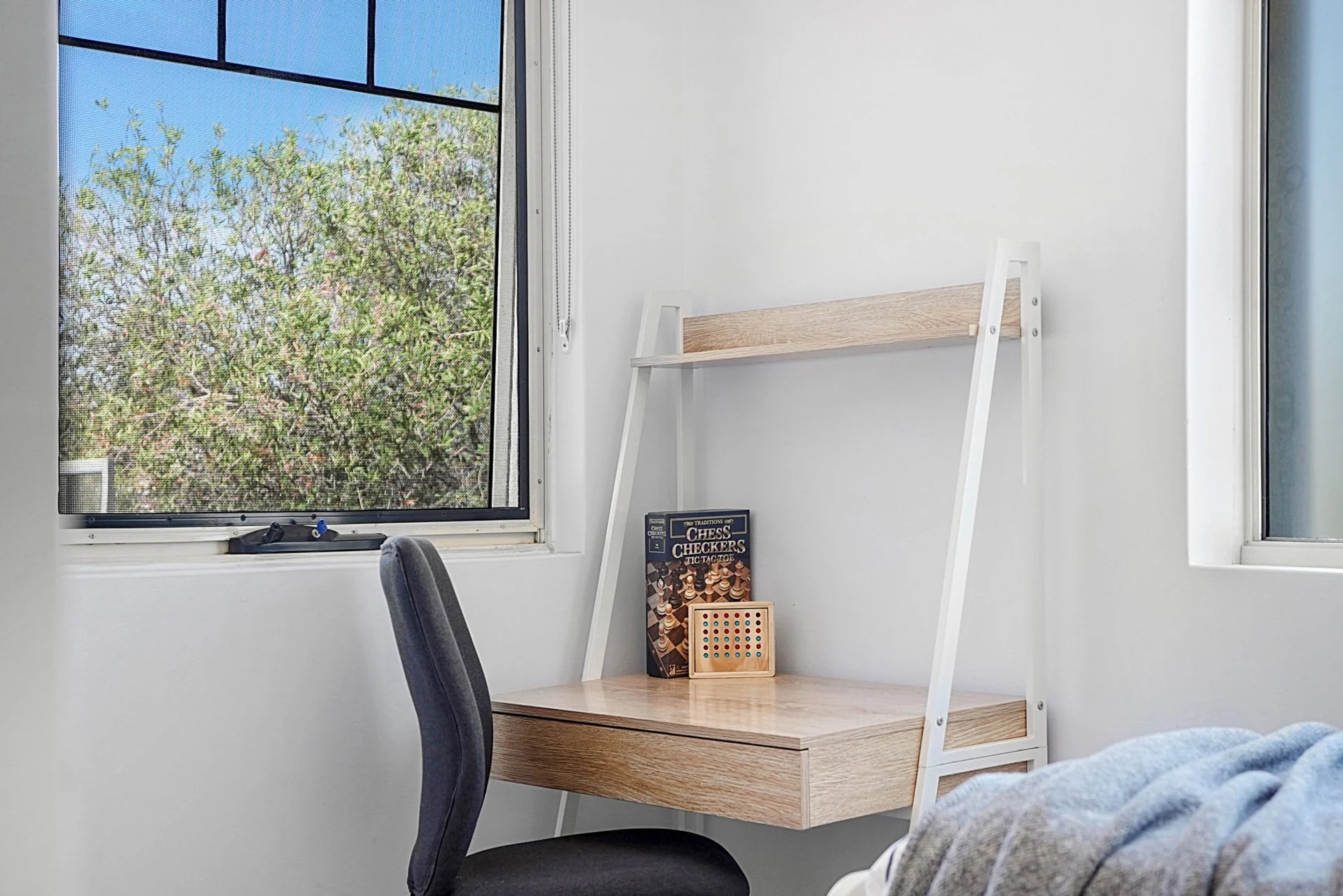 Modern desk and chair in a well lit white room. Perth Short Term rentals