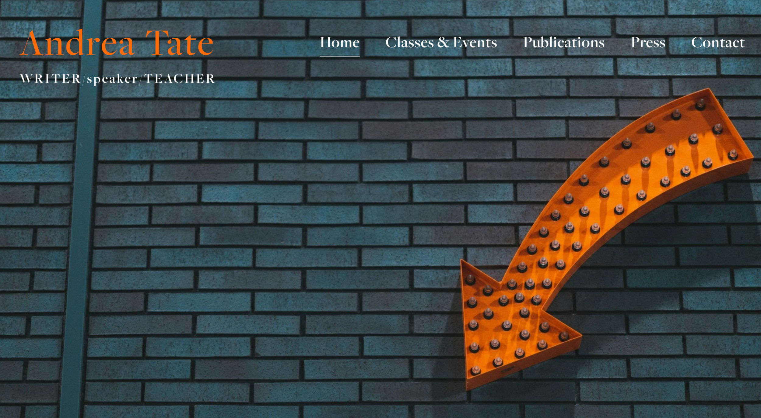 Website homepage featuring a dark brick wall background with orange arrow sign pointing to the left and menu options: Home, Classes & Events, Publications, Press, Contact. Text overlay includes 'Andrea Tate' and 'WRITER speaker TEACHER'.