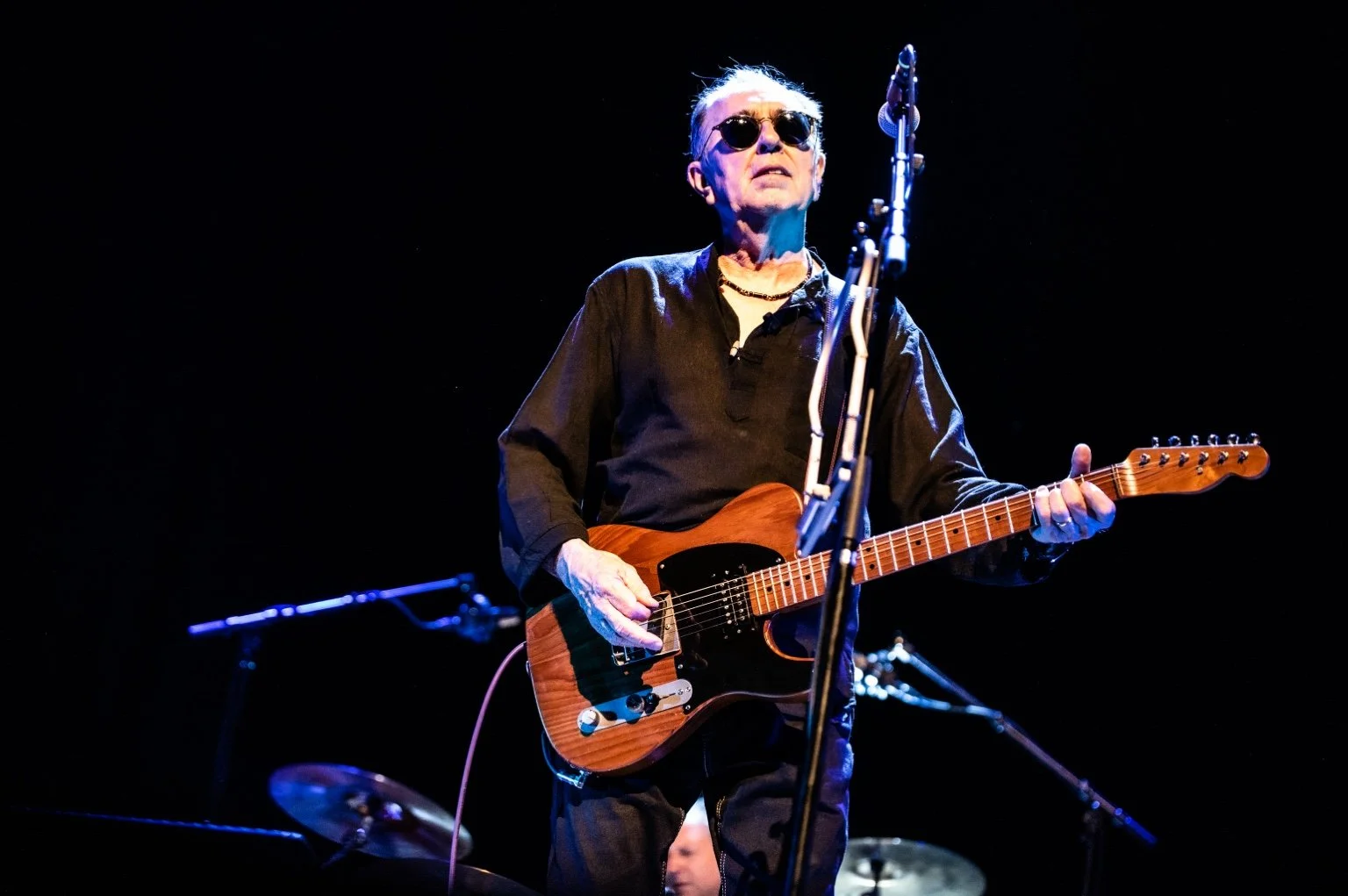 David Surkamp performing with electric guitar at De Roma.
