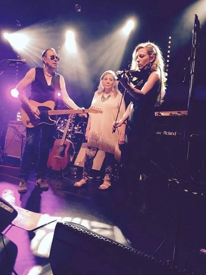 David Surkamp playing guitar with Pavlov’s Dog on stage.
