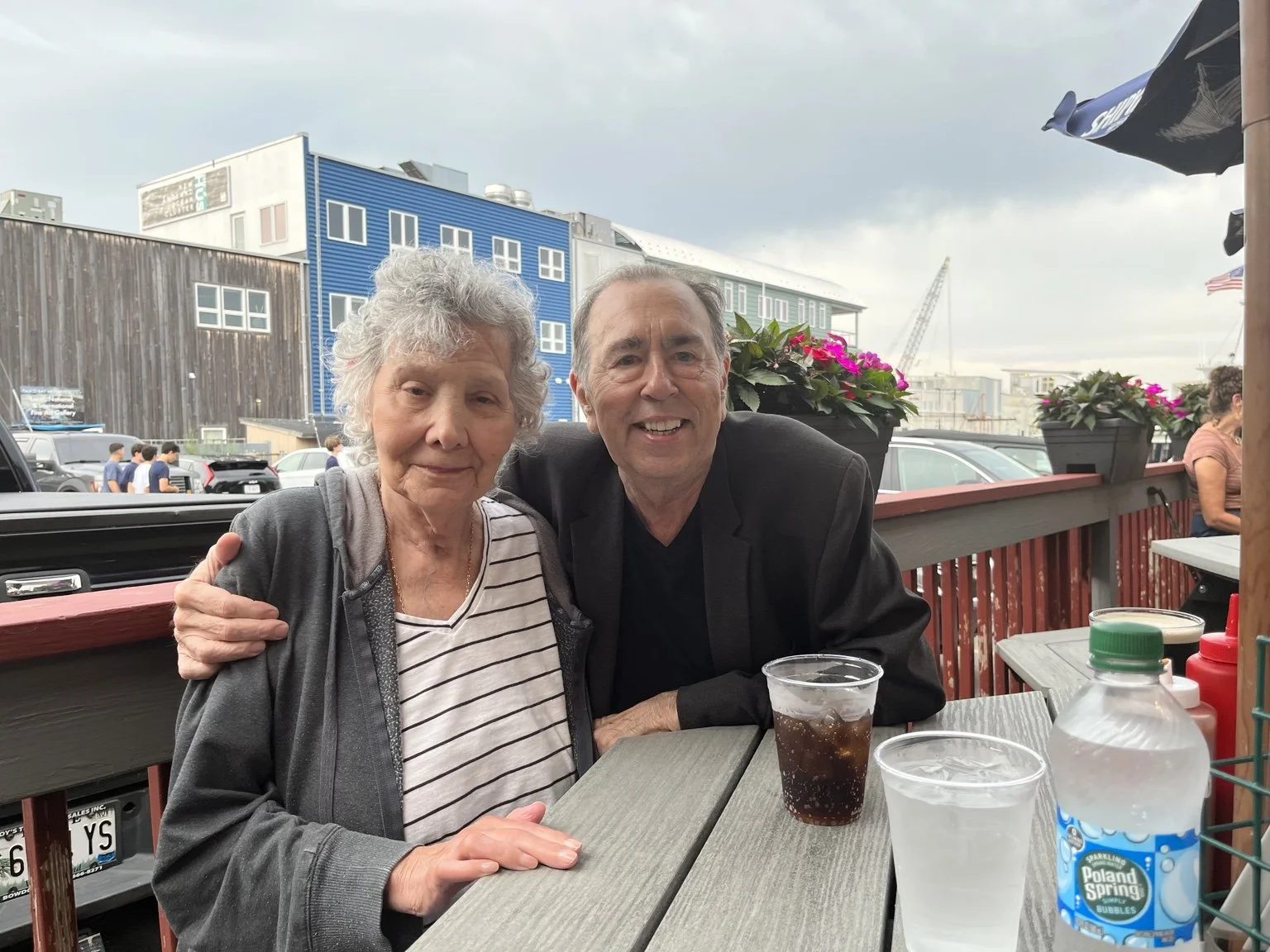 David Surkamp with a companion at an outdoor café.
