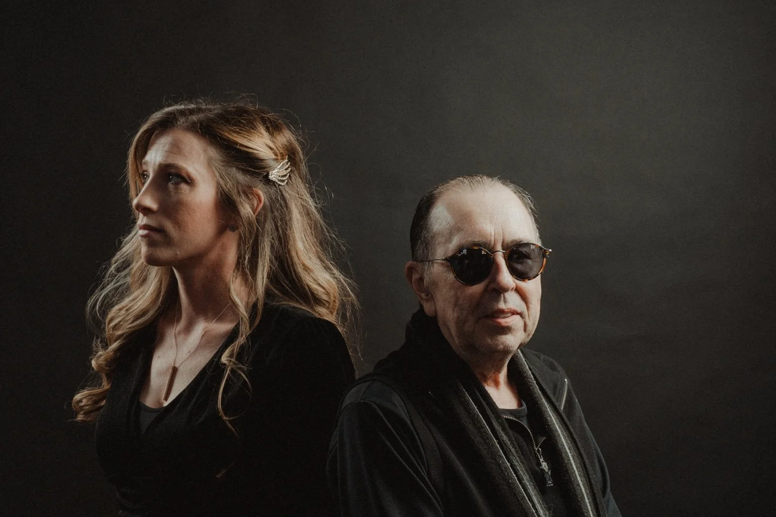 David Surkamp with a companion in a softly lit portrait.