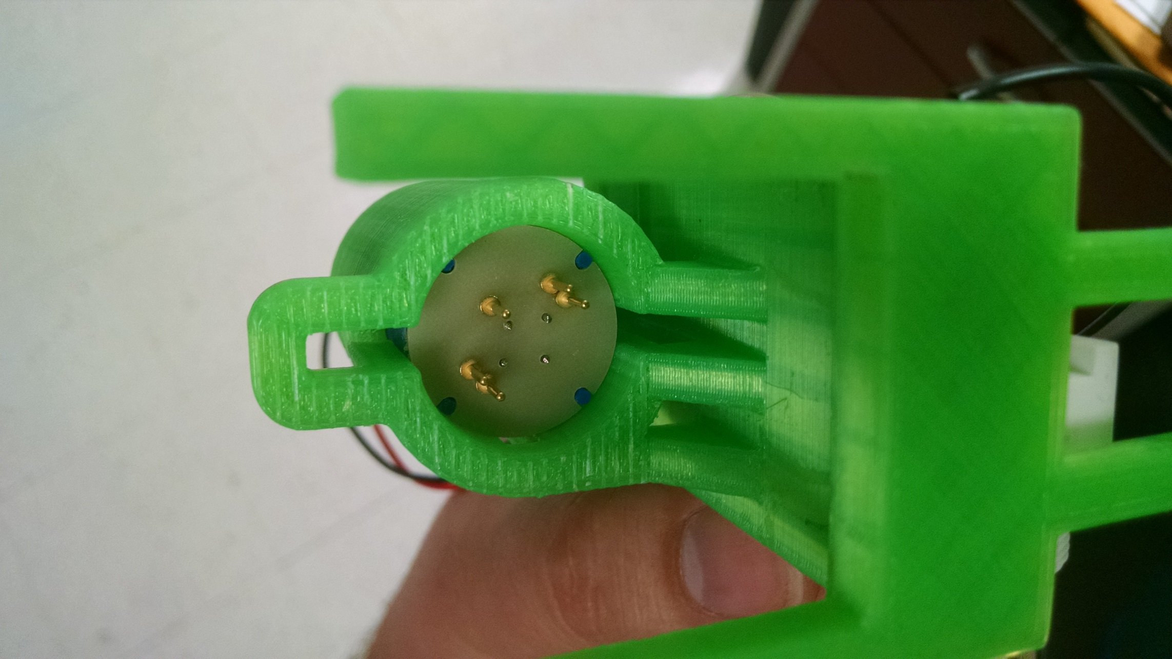 Contact pins on plunger retracted, viewed from the bottom with the insert tray removed.